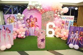 Birthday party decoration with balloons and character cutouts