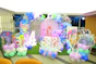 Birthday party decorations with balloons and a cake
