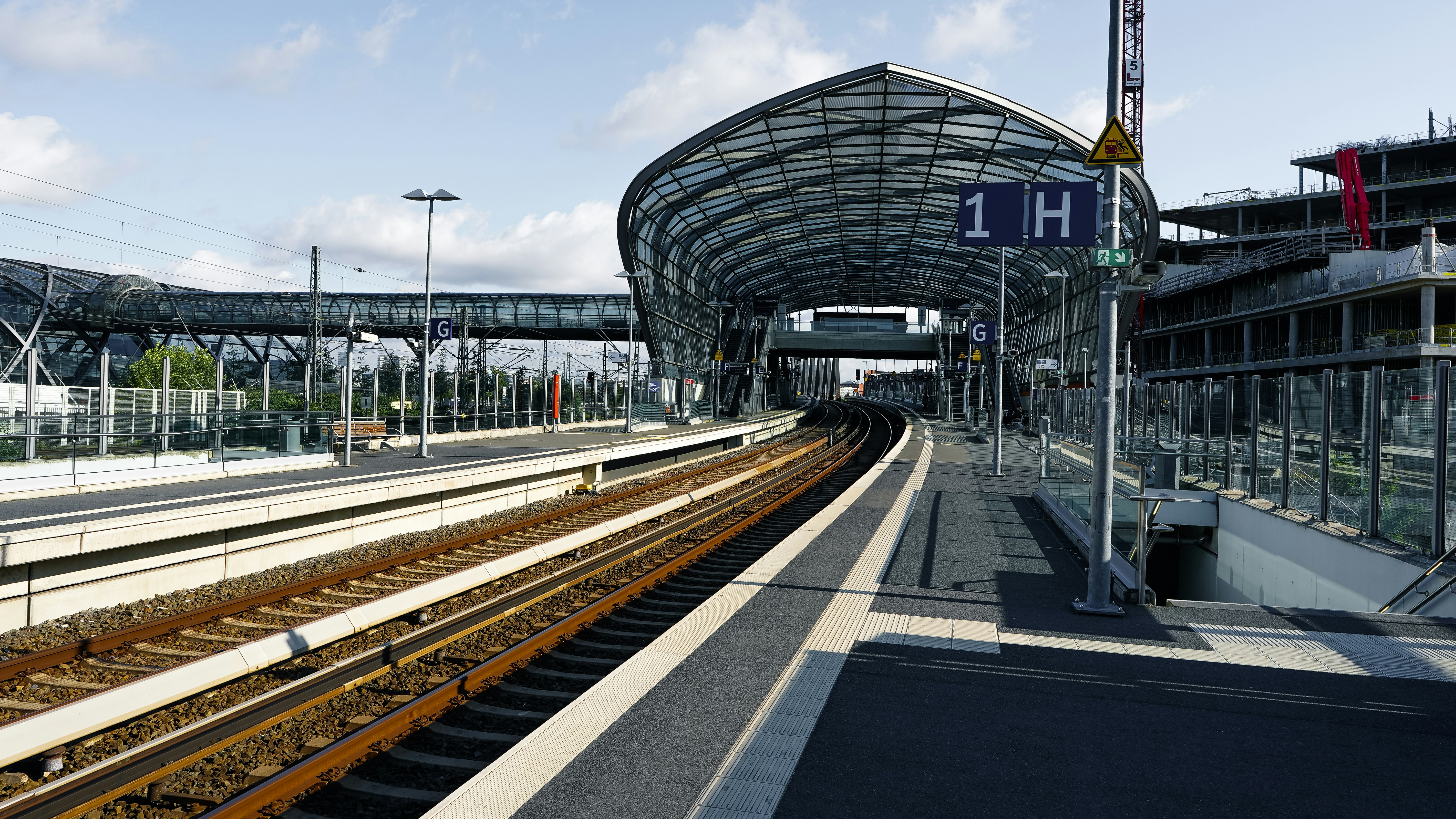 Modern train station with tracks and covered platforms