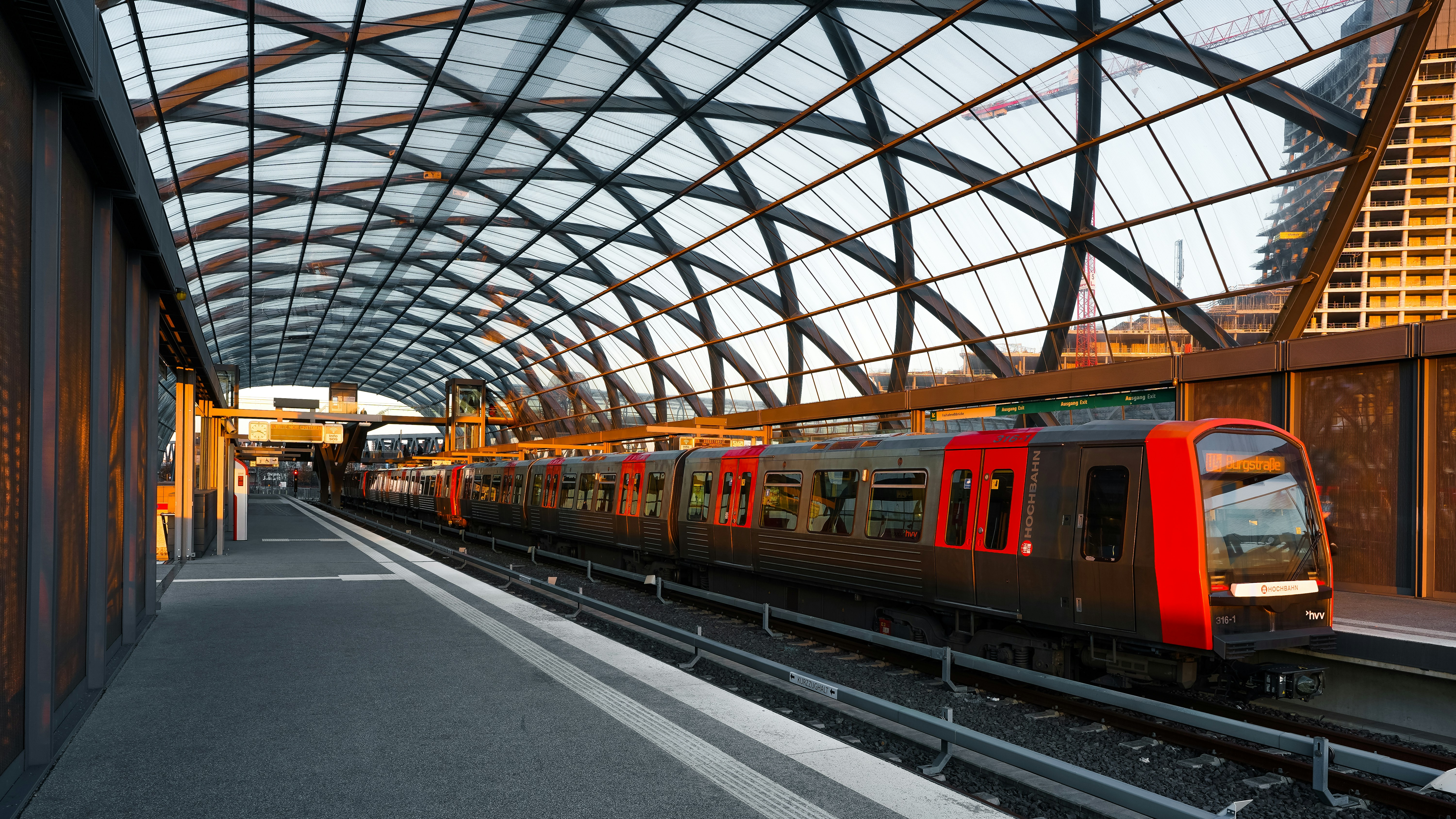 Modern train station with a train on the tracks.