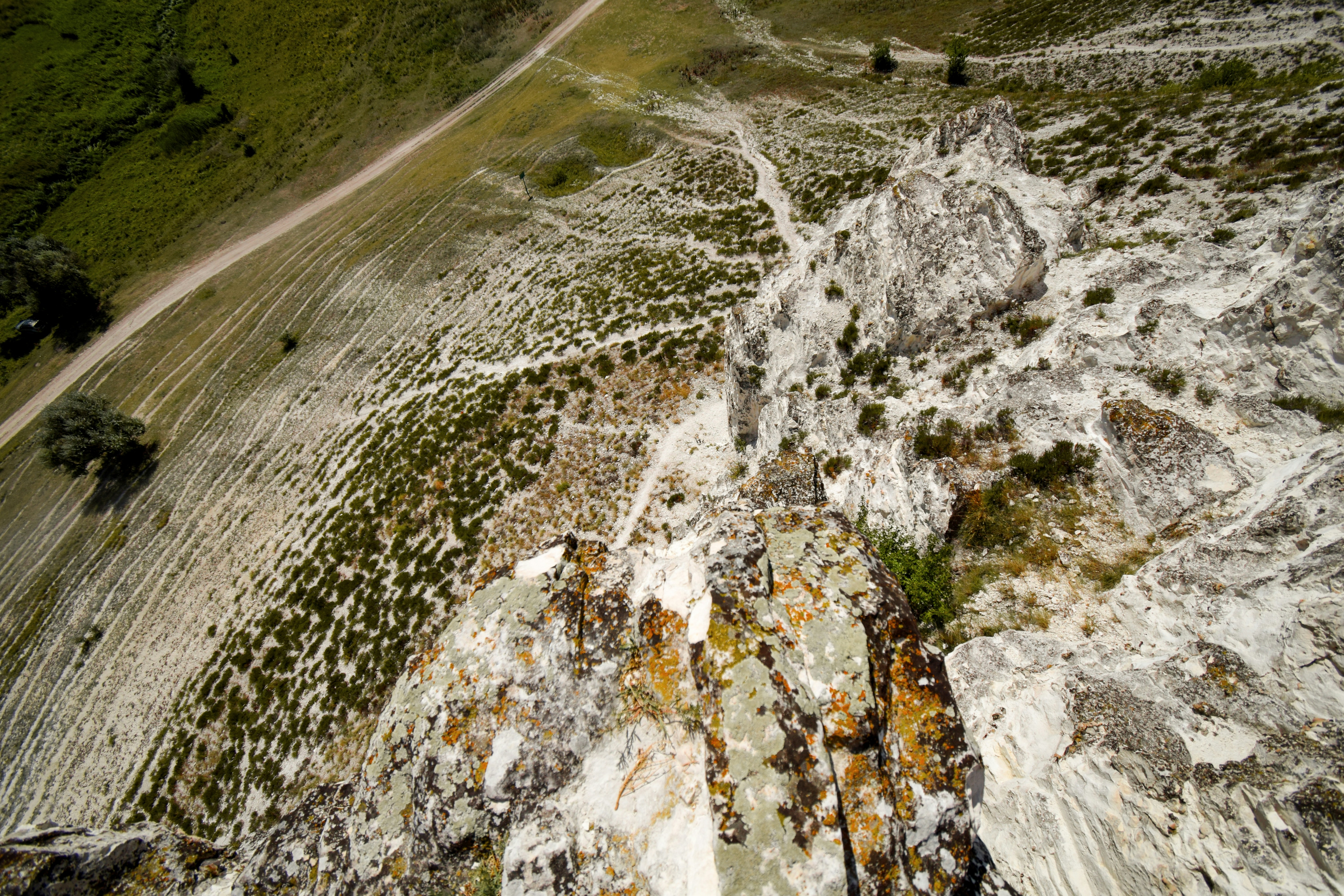 Rocky cliff face with a winding path above