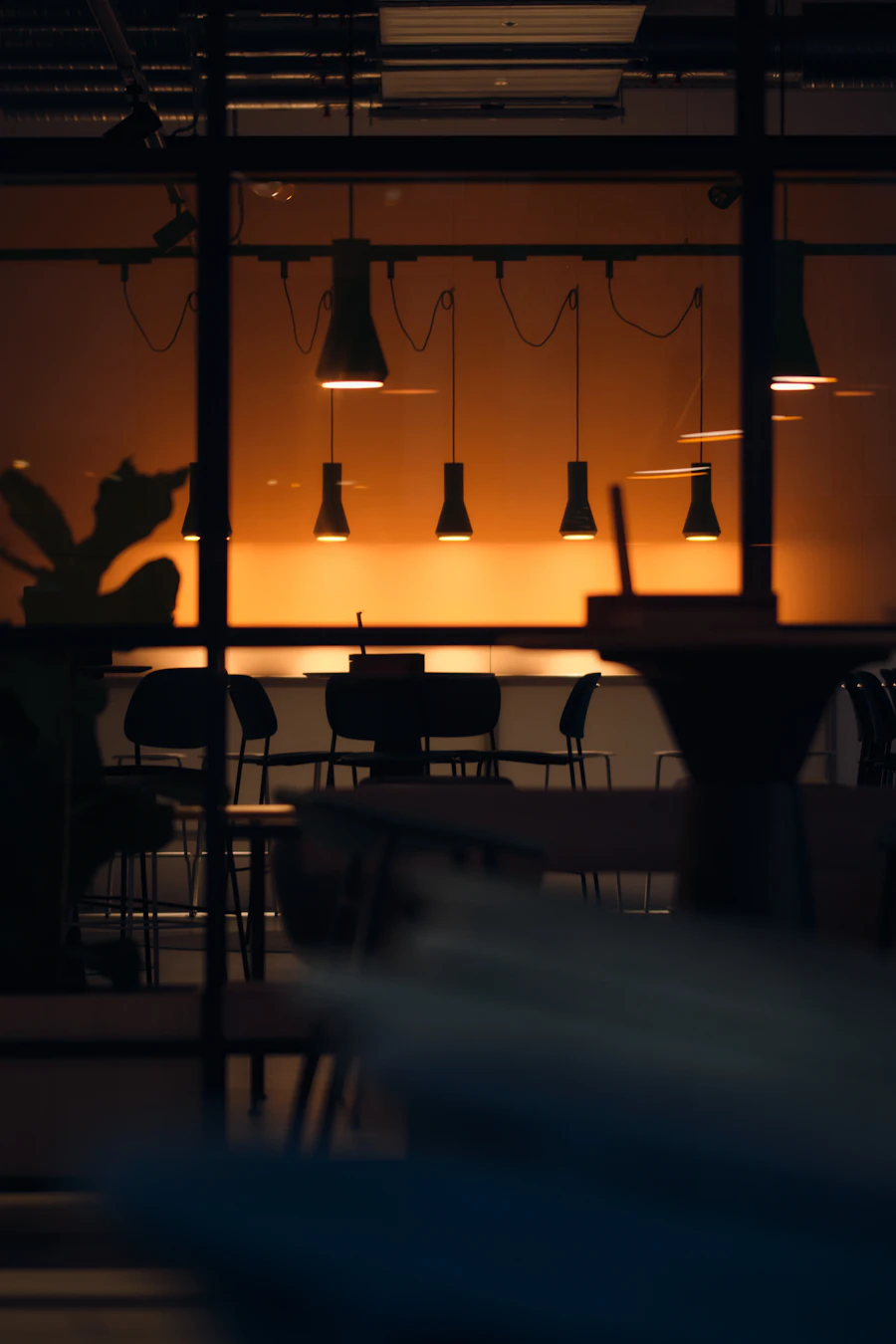 Modern restaurant dining room with pendant lights