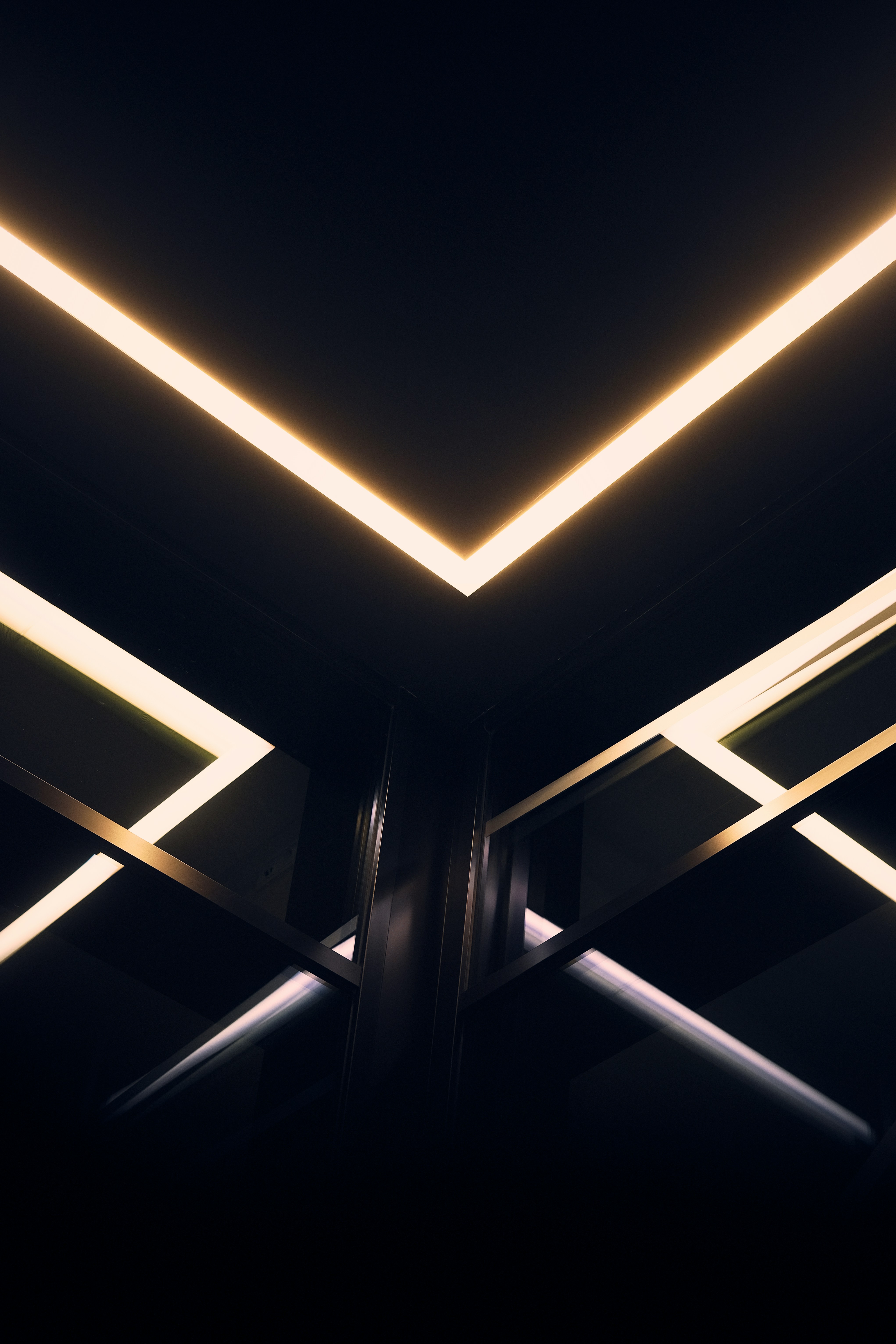 Modern architecture with glowing geometric ceiling lights