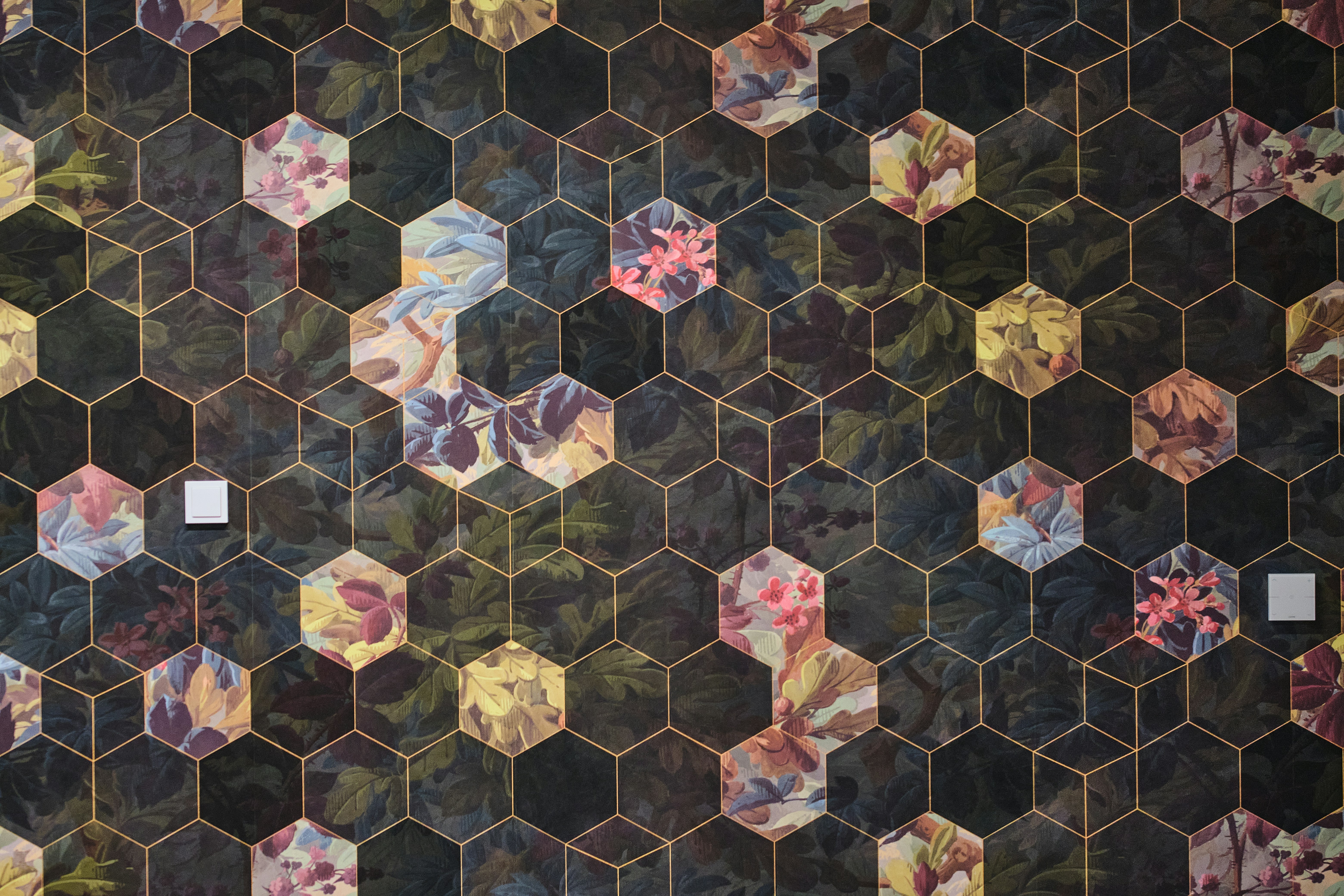 Hexagonal tiles with floral patterns and gold accents
