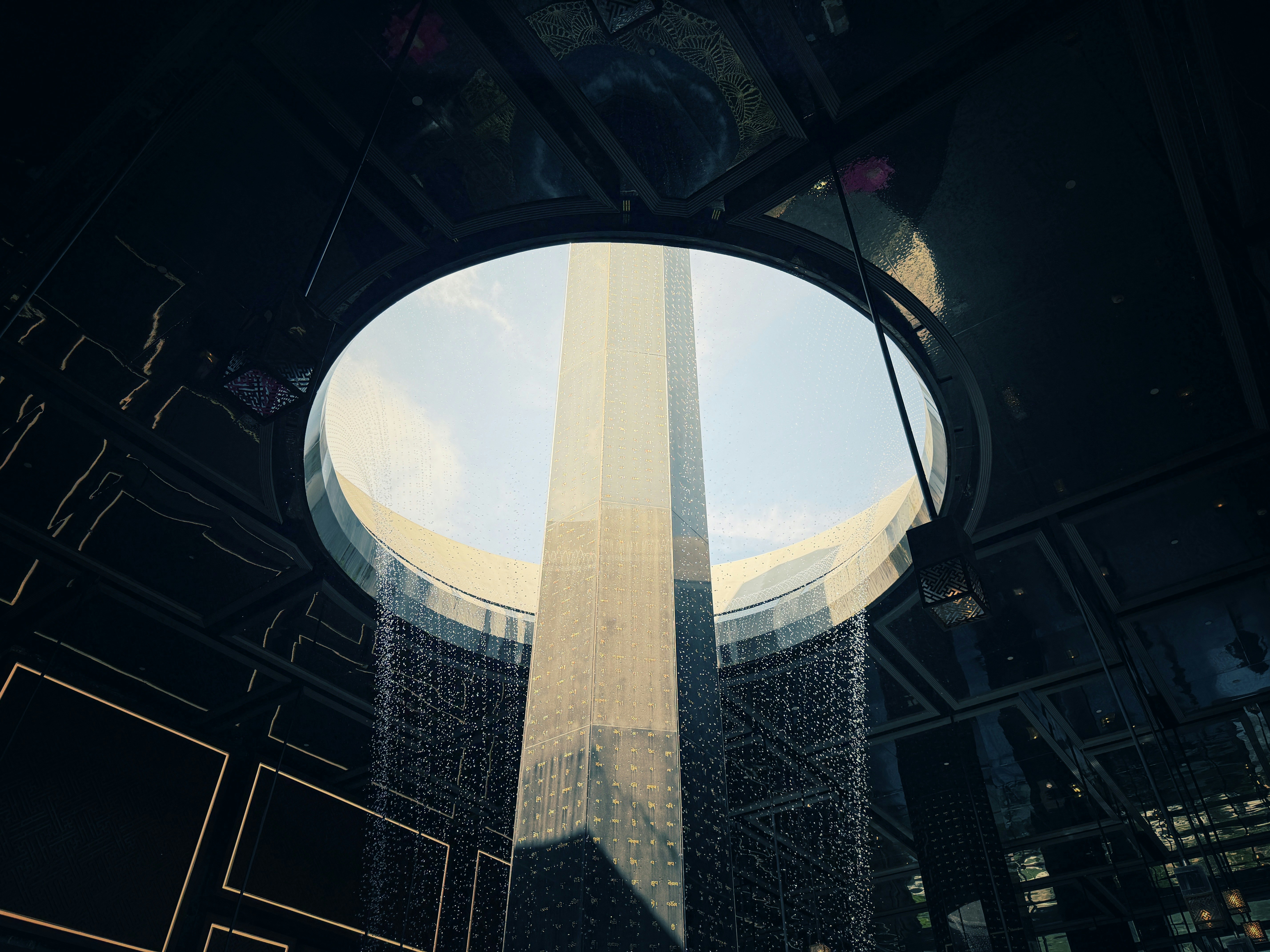 Modern skyscraper viewed through a circular opening