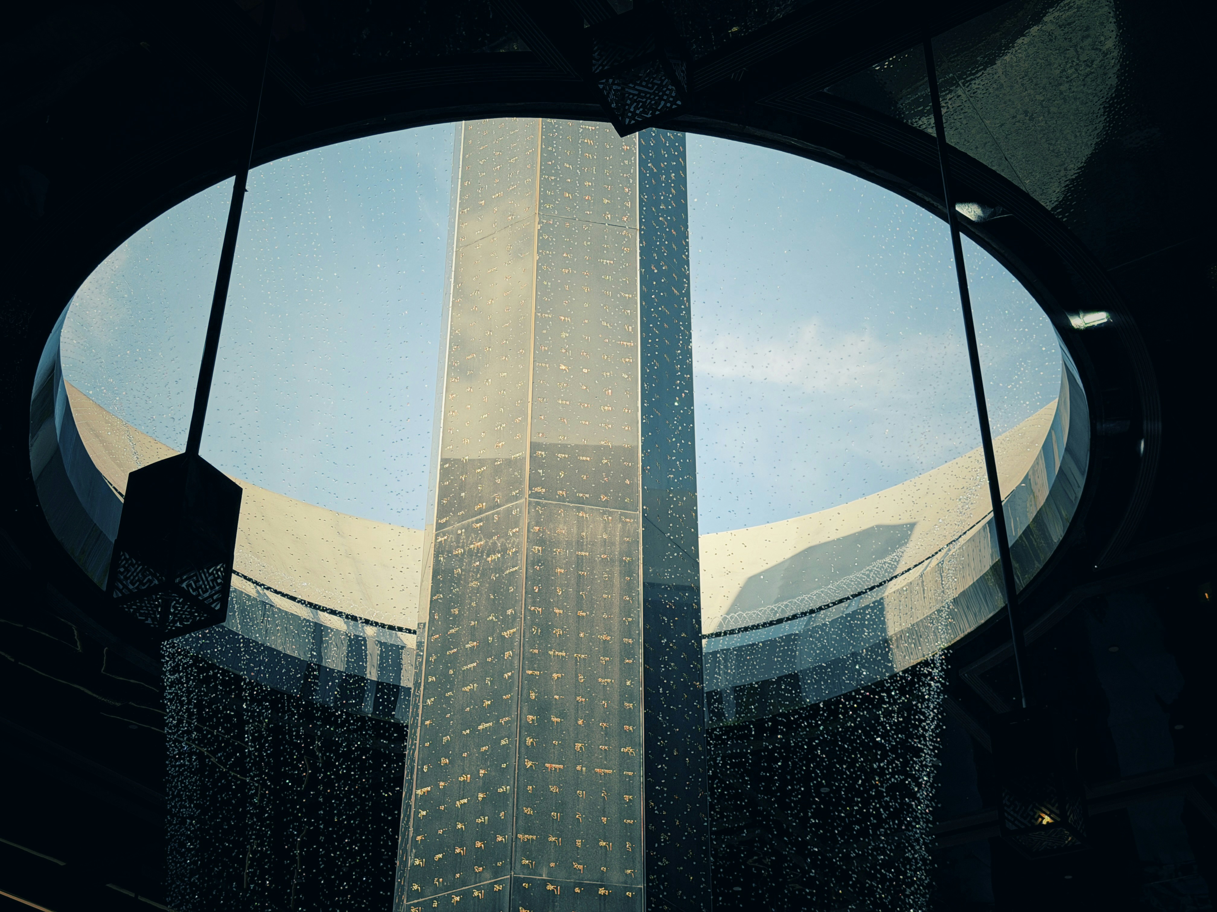Modern skyscraper viewed through a circular opening