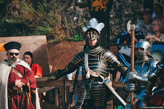Knights in armor at a historical reenactment event.