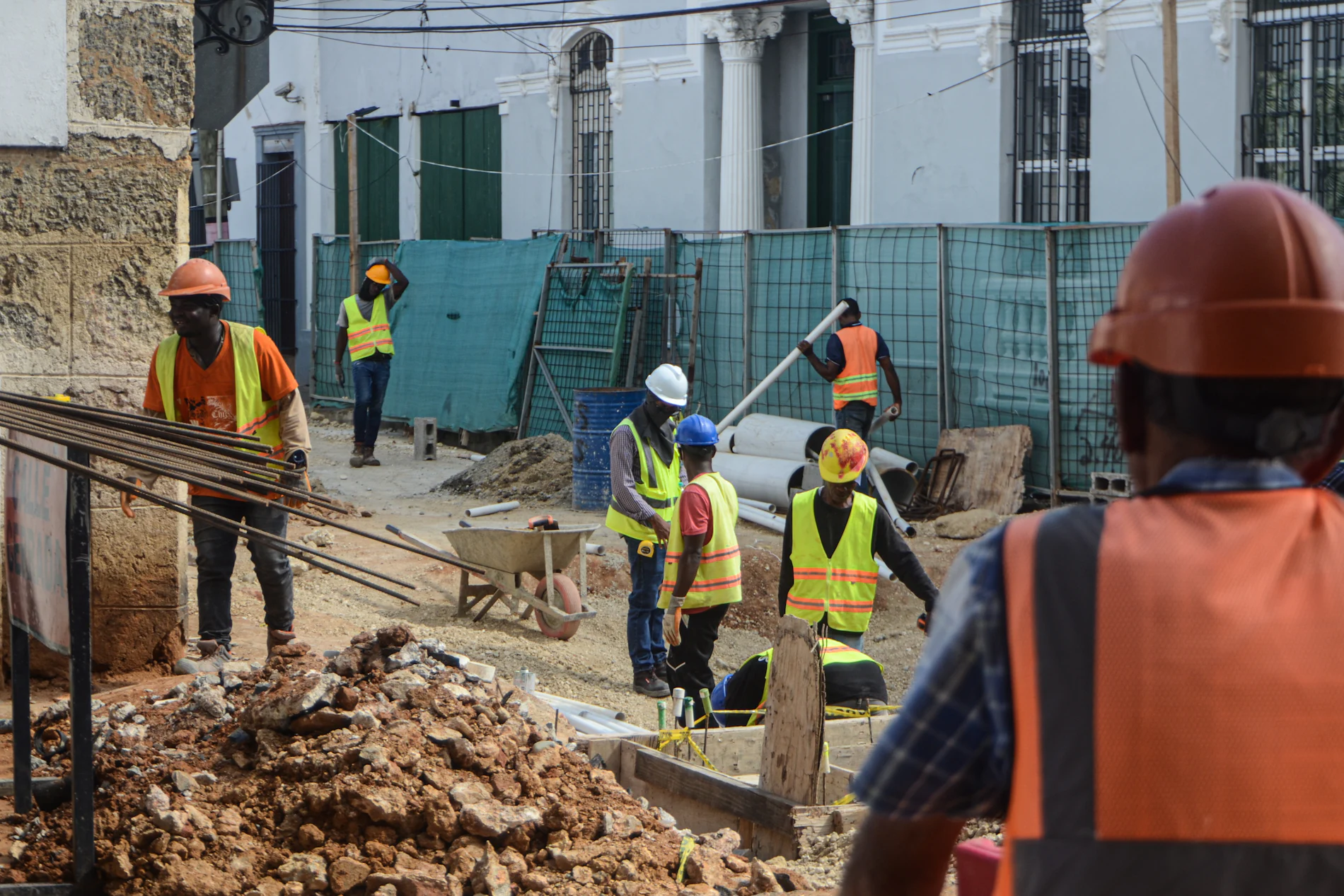 Safety professionals reviewing work on an active job site