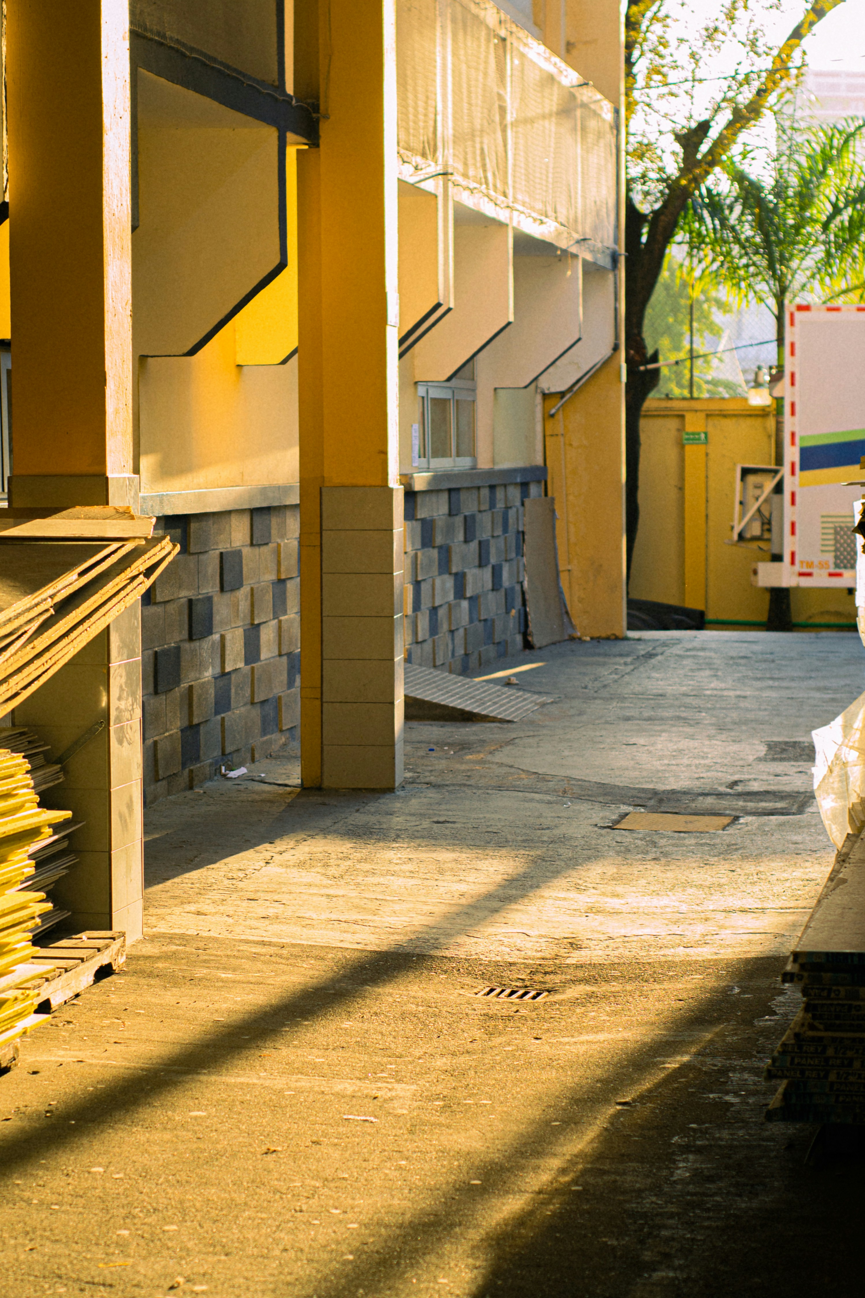 Sunlight streaming across construction site materials