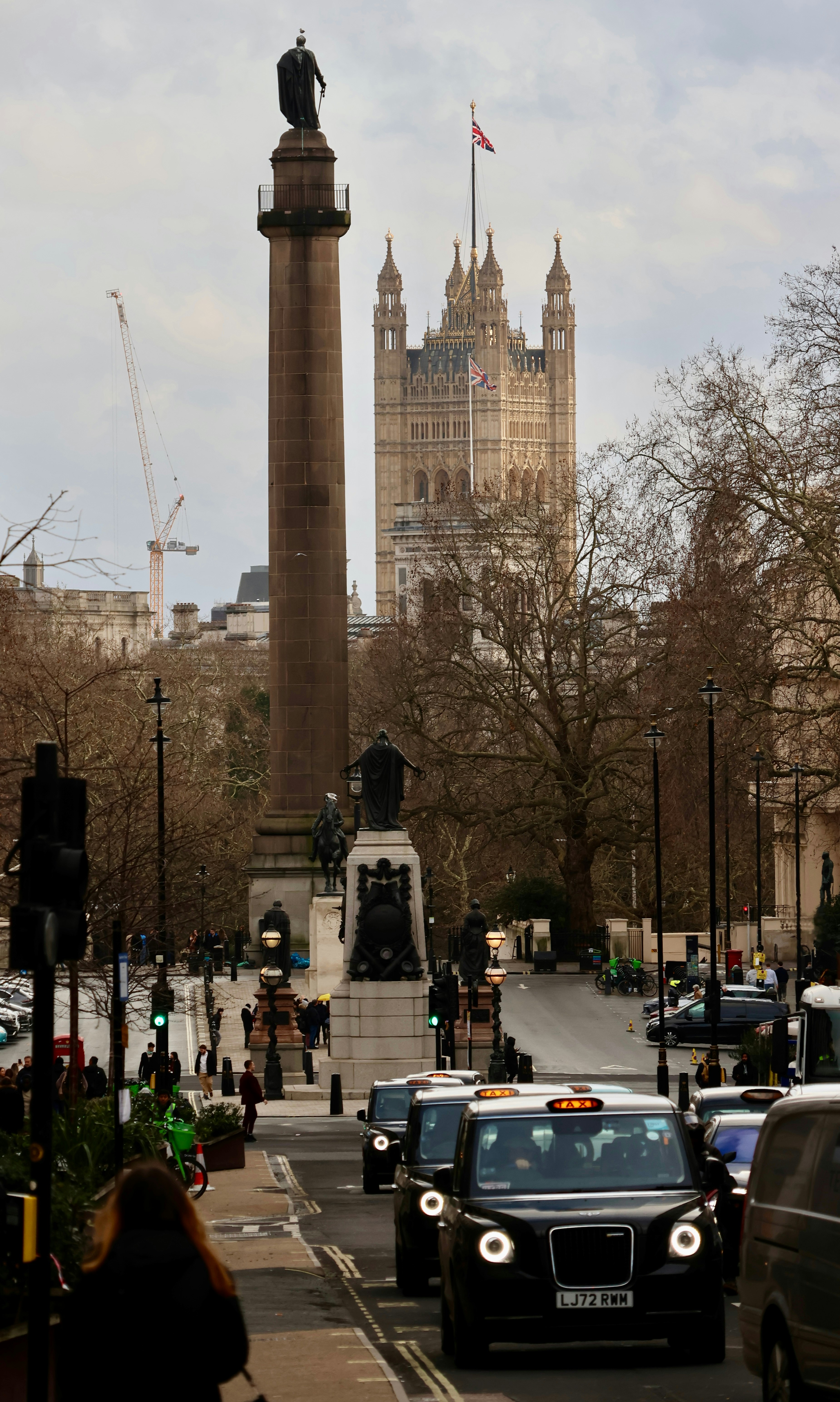 London street scene with black cabs and parliament building