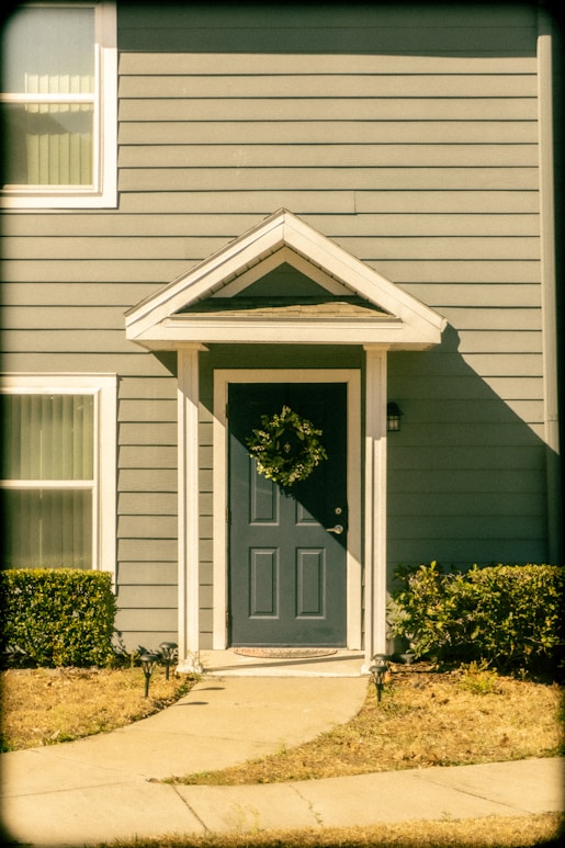Front door with wreath and pathway