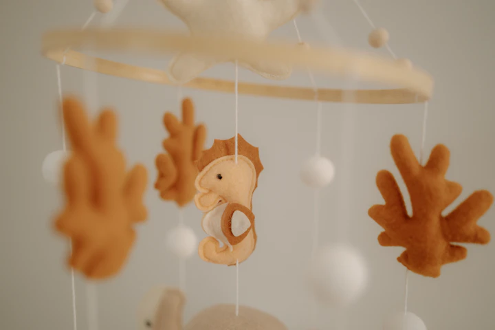 Baby nursery mobile with felt decorations