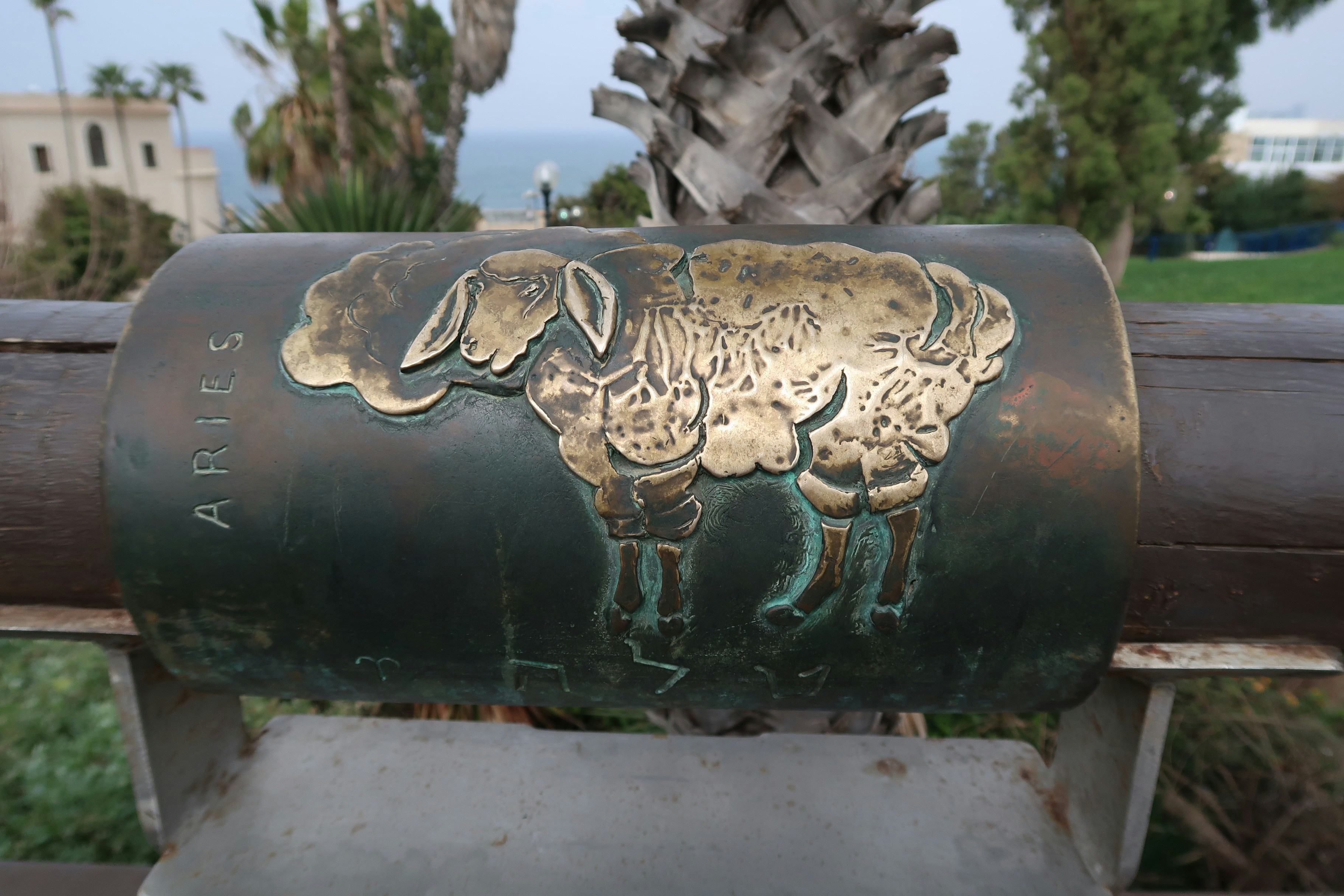 Aries zodiac sign on a metal cylinder
