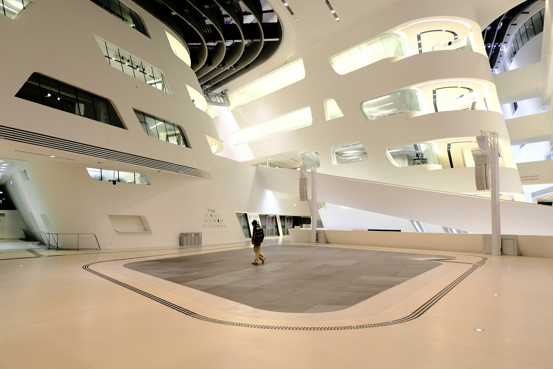 Modern architectural interior with a lone person