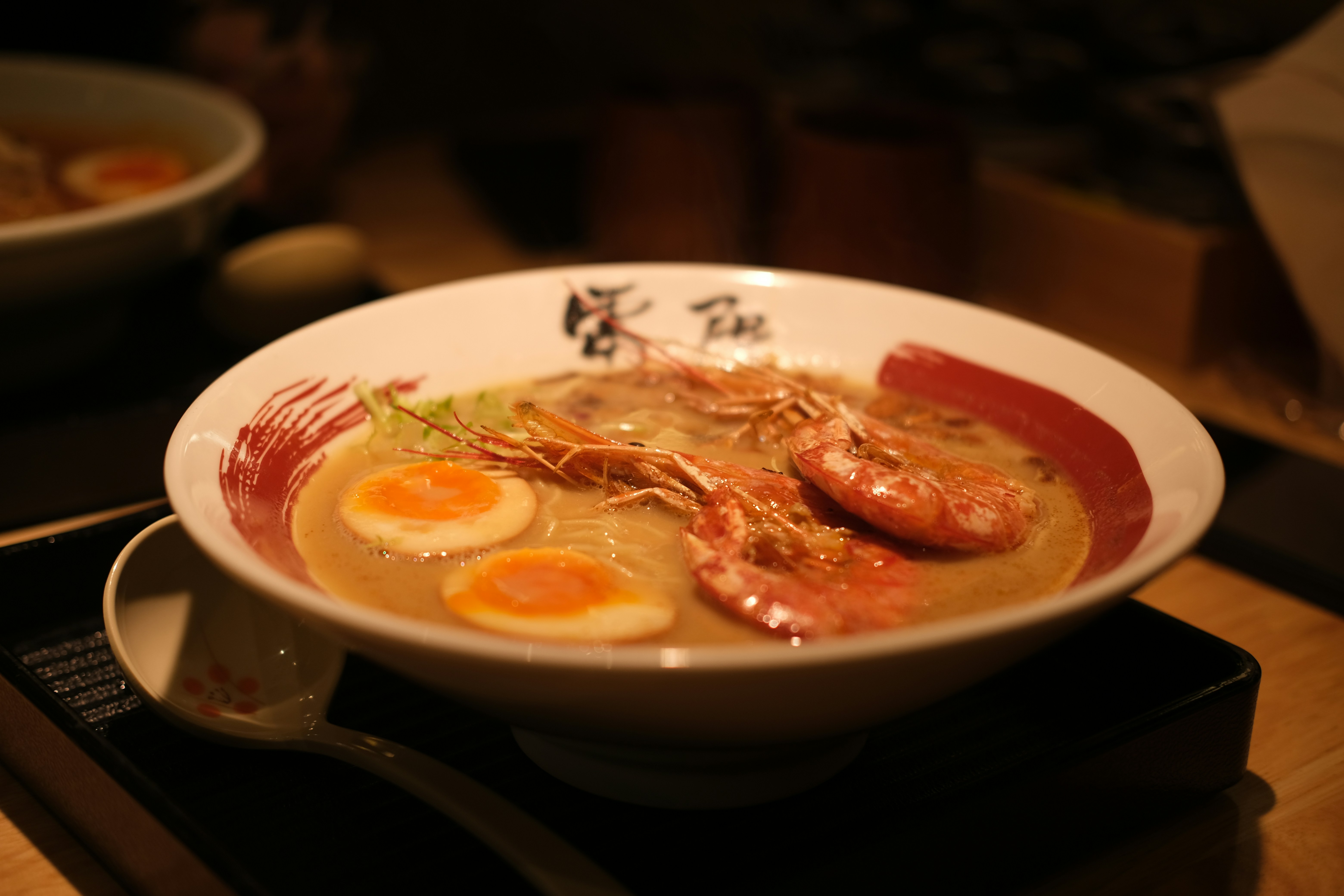 Bowl of ramen with shrimp and eggs