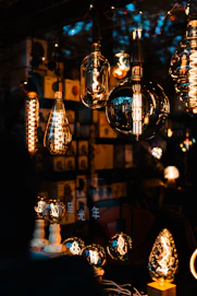 Various vintage edison light bulbs illuminated at night.