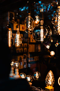 Various vintage edison light bulbs illuminated at night.