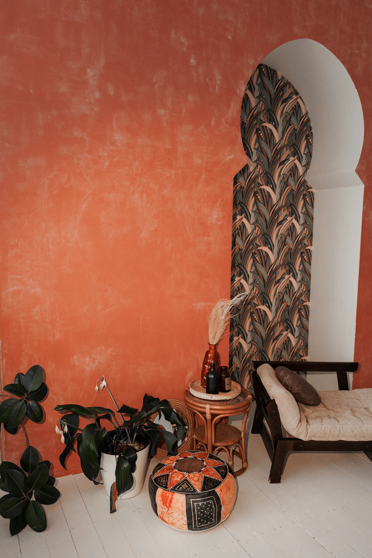 Bohemian room with a leather pouf and seating
