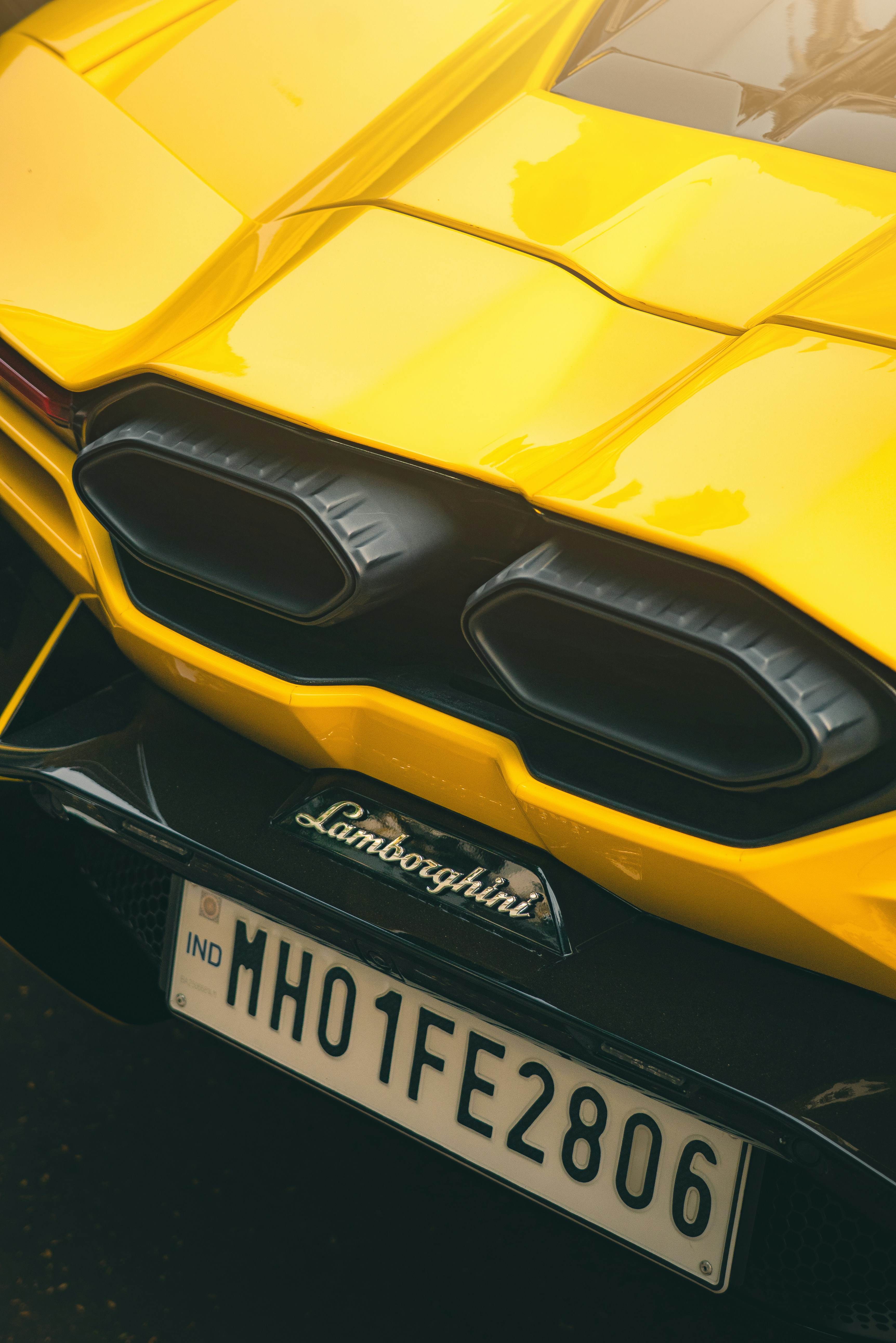 Yellow lamborghini sports car rear detail