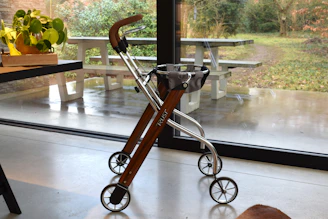 A modern walker with wheels and a basket