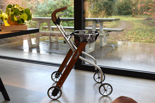 A modern walker with wheels and a basket