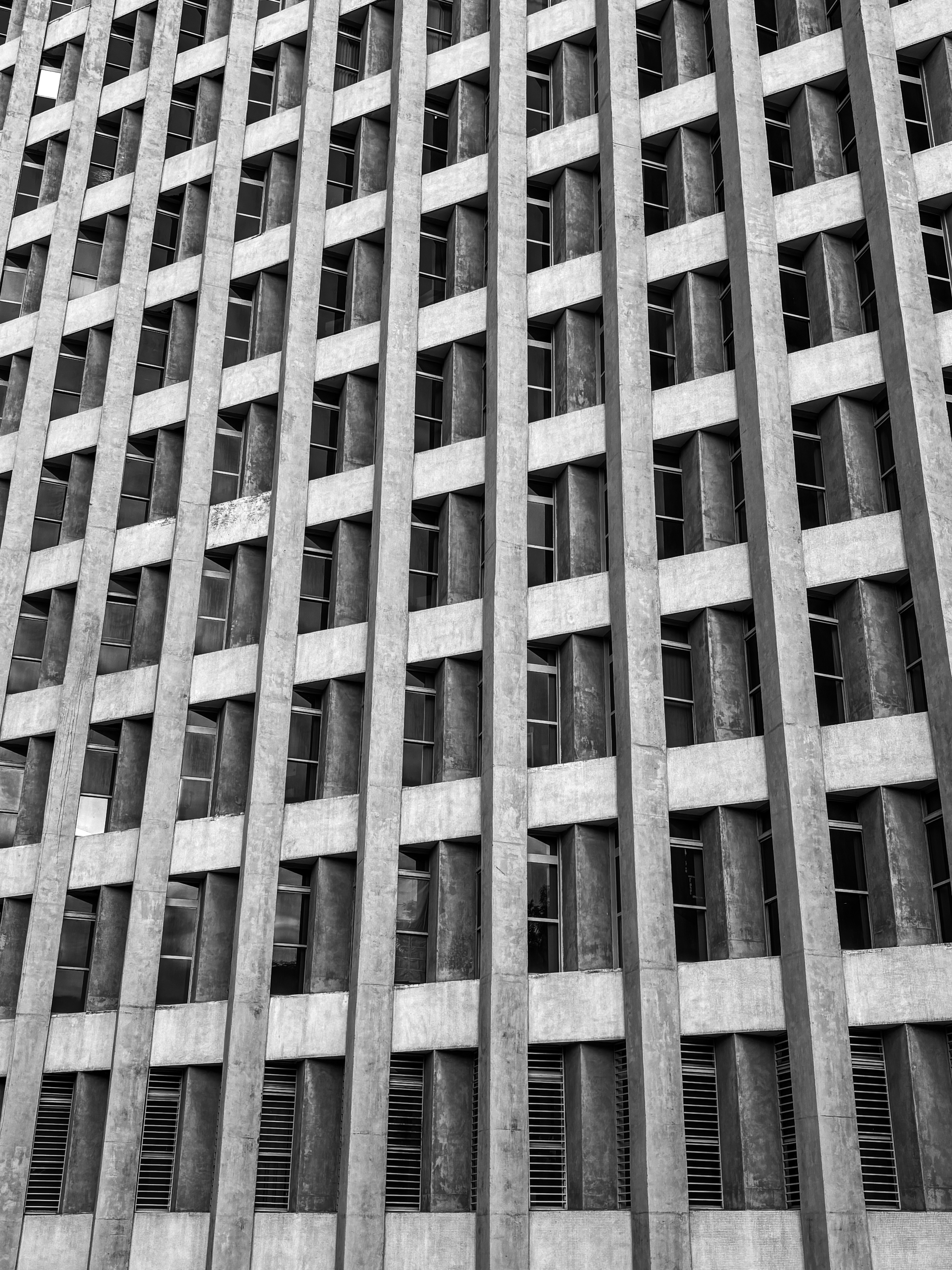 Pattern of windows on a brutalist concrete building