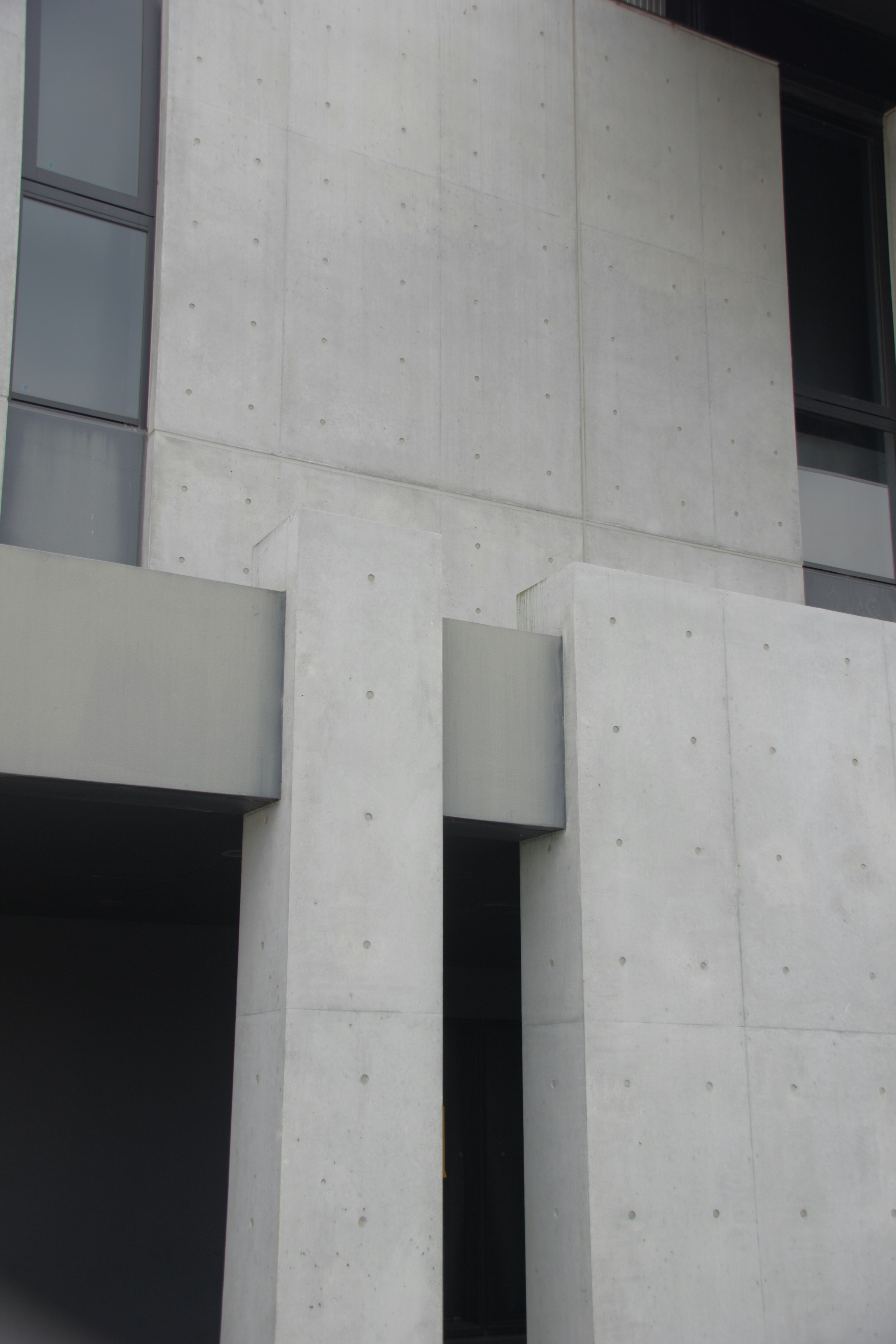 Modern concrete building with dark windows