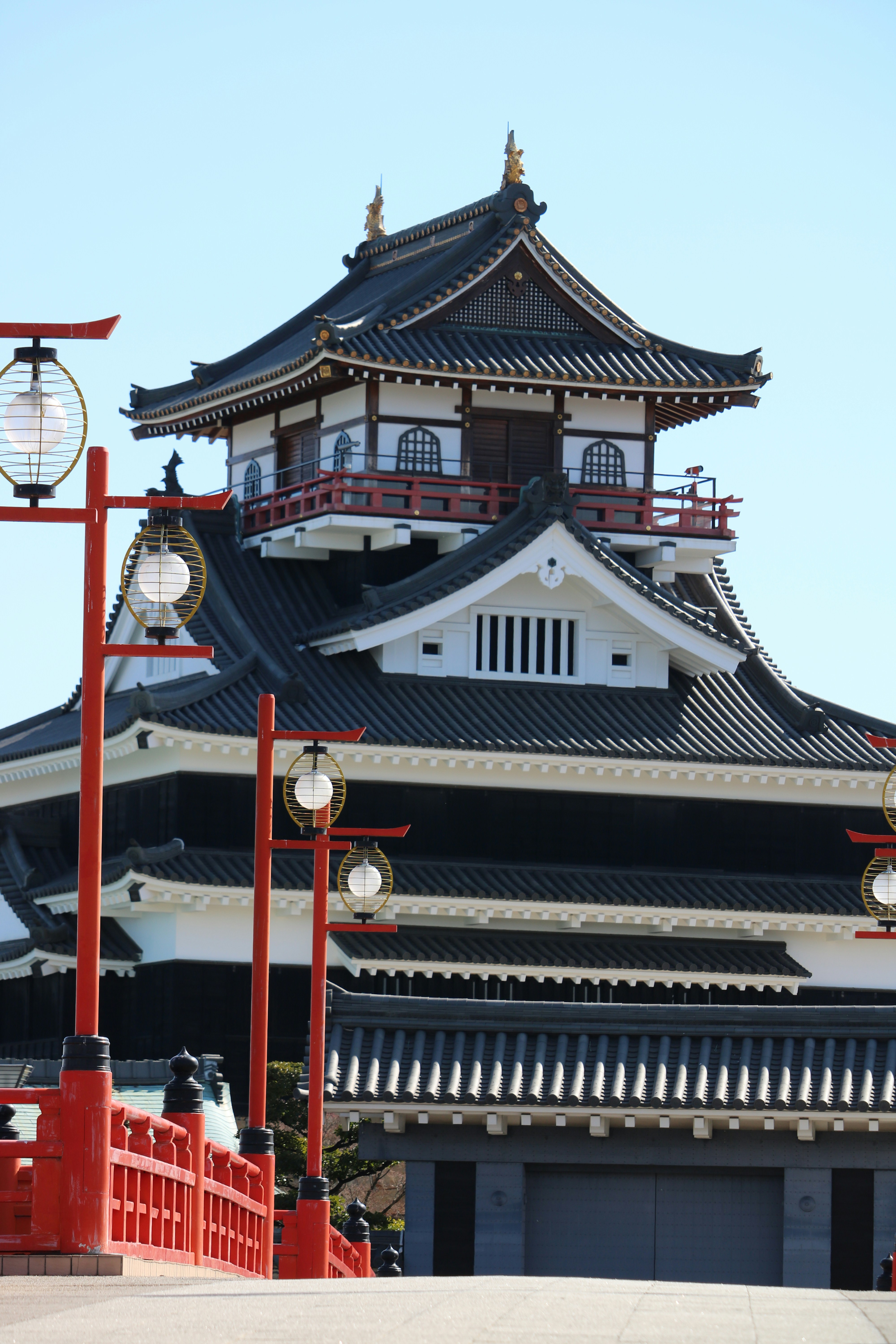 Traditional japanese castle with red bridge and lanterns