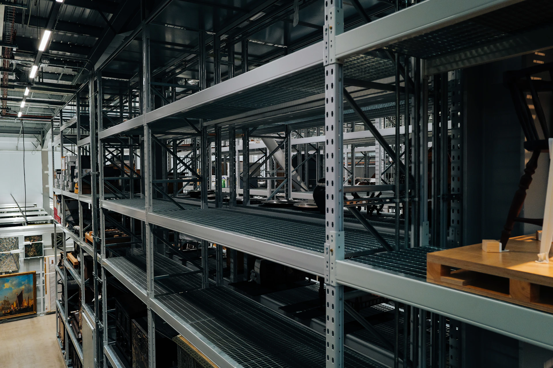 Industrial shelving units with various items stored