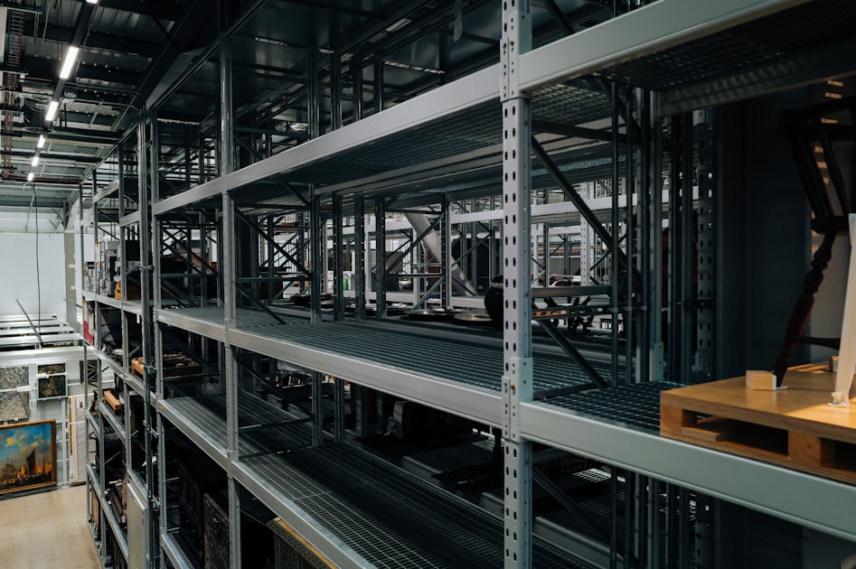 Industrial shelving units holding organized parts inventory, representing a spare-parts catalog rebuilt for easier product findability