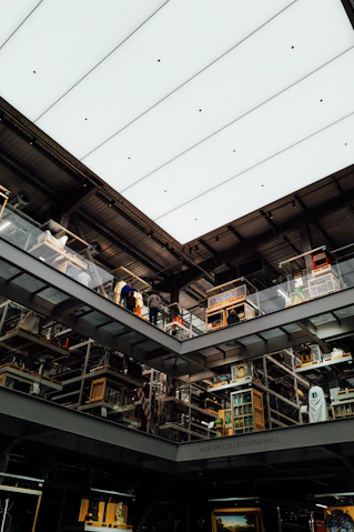 People walking on elevated walkways in a modern building.