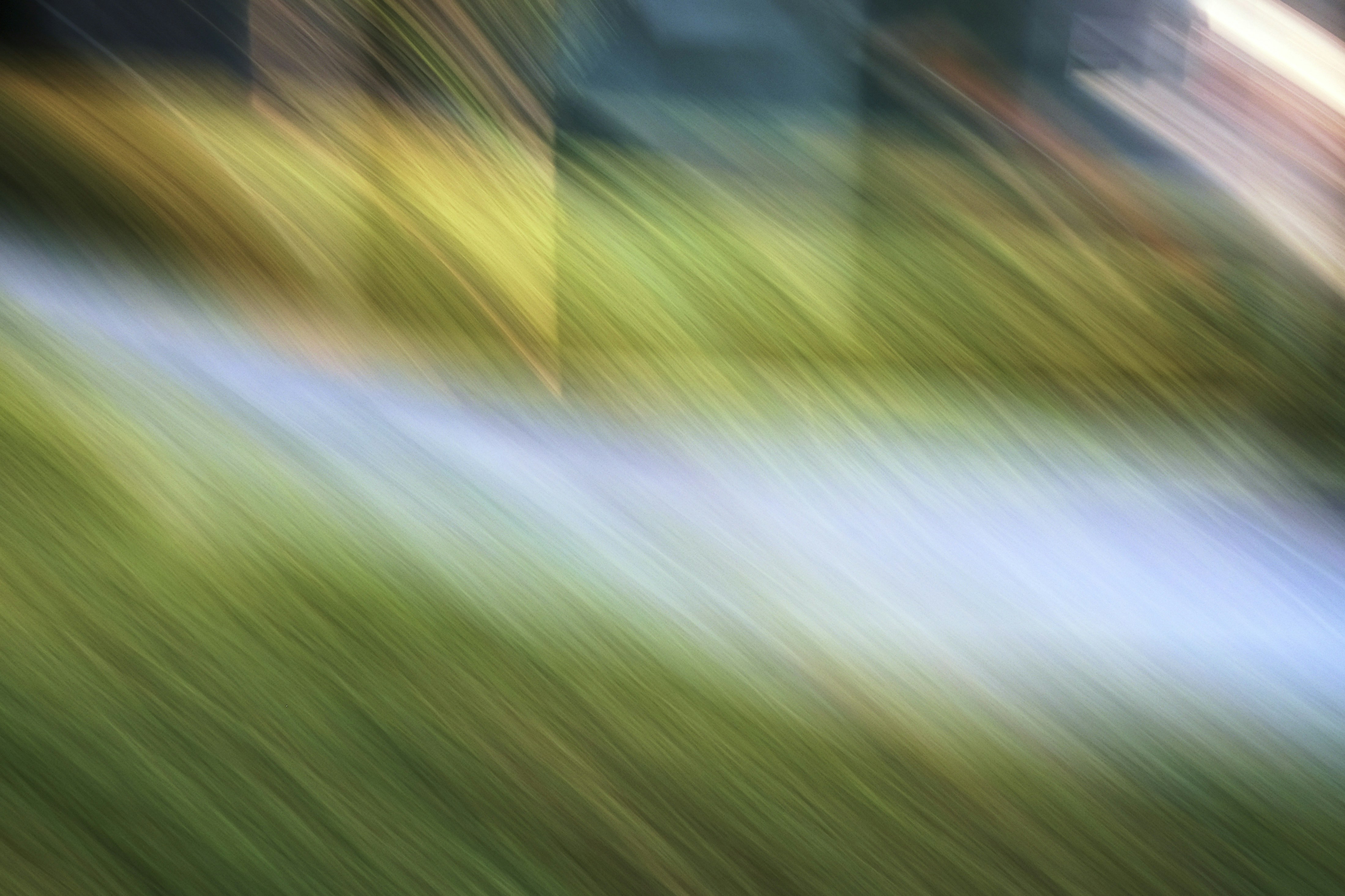 Abstract streaks of green, yellow, and blue