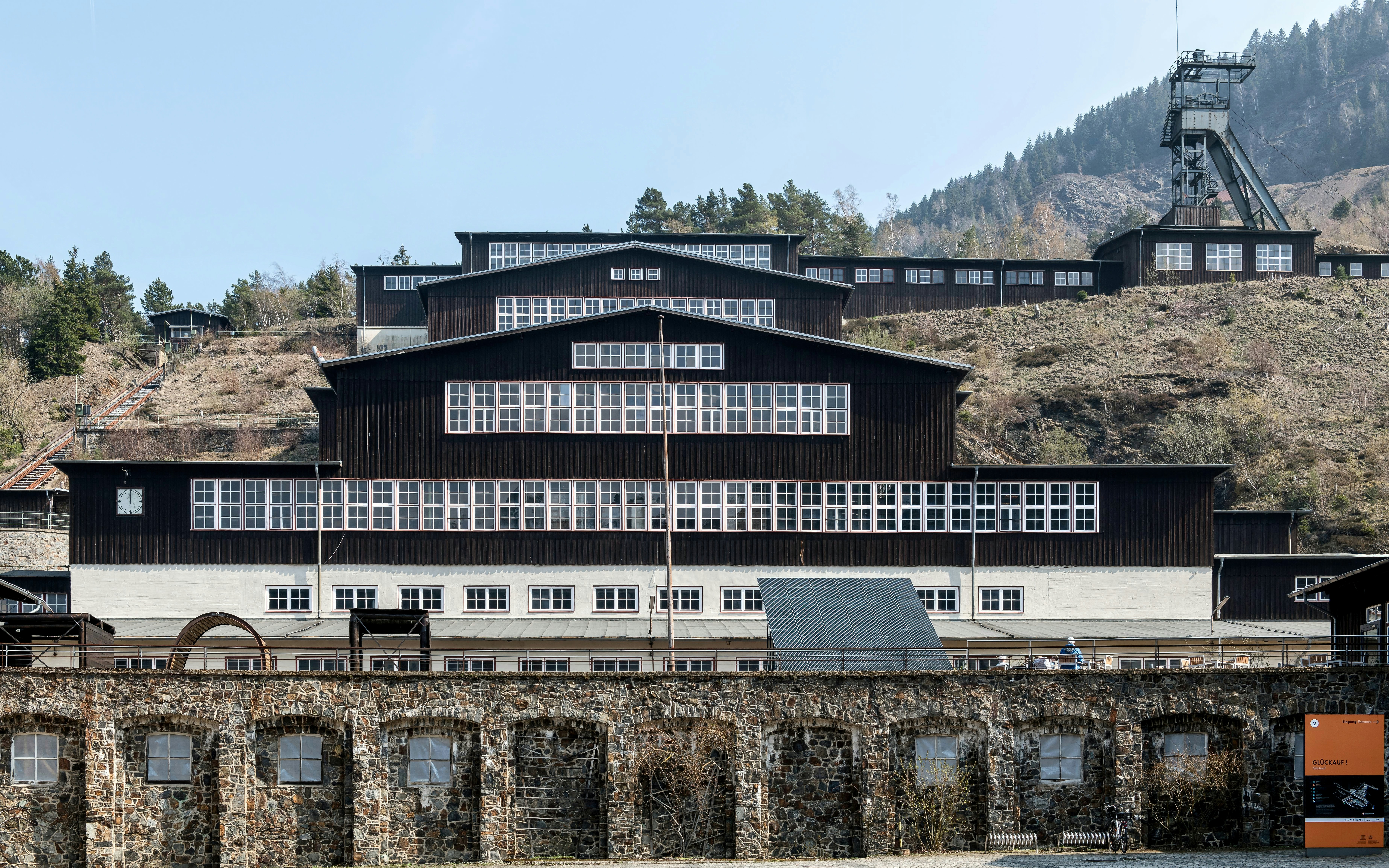 Historic industrial buildings on a hillside