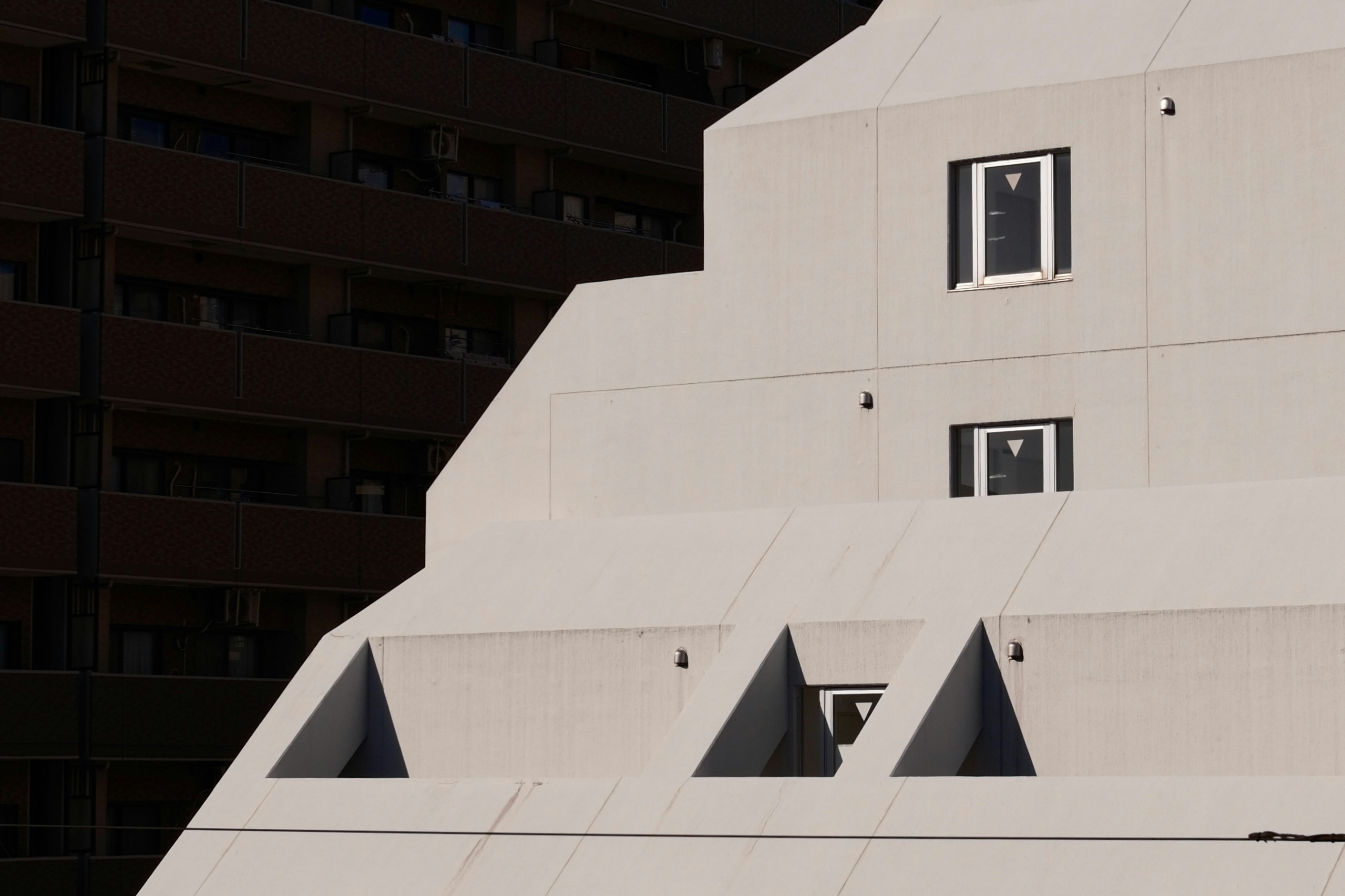 Modern tiered building with geometric windows