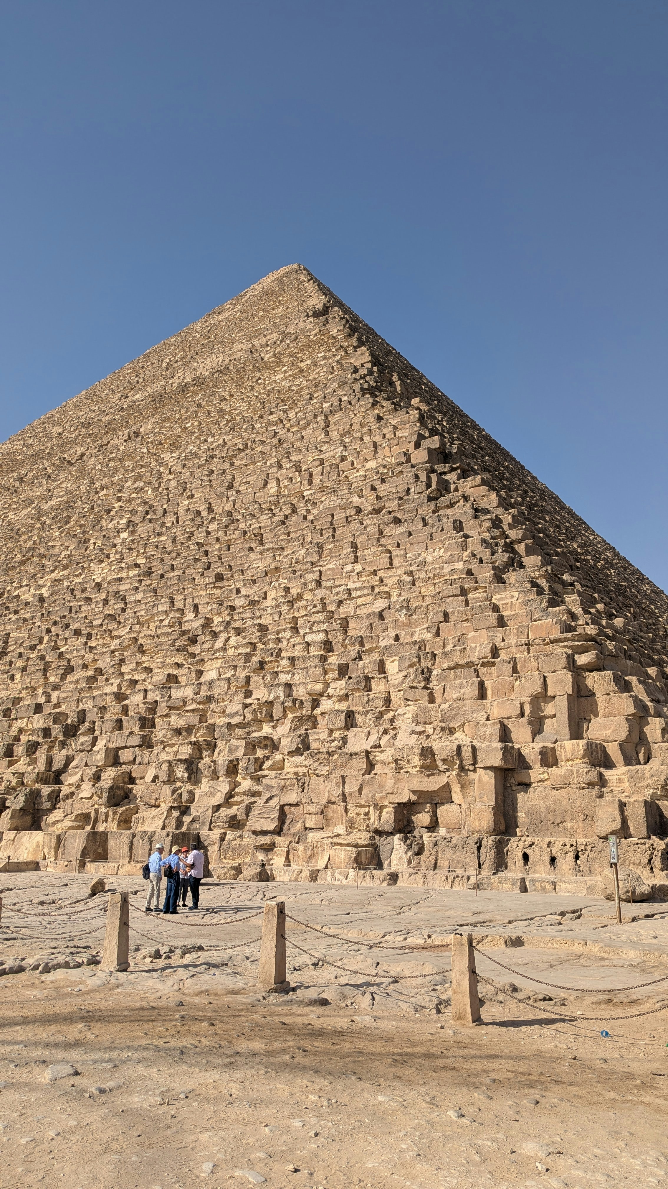 Ancient stone pyramid under a clear blue sky