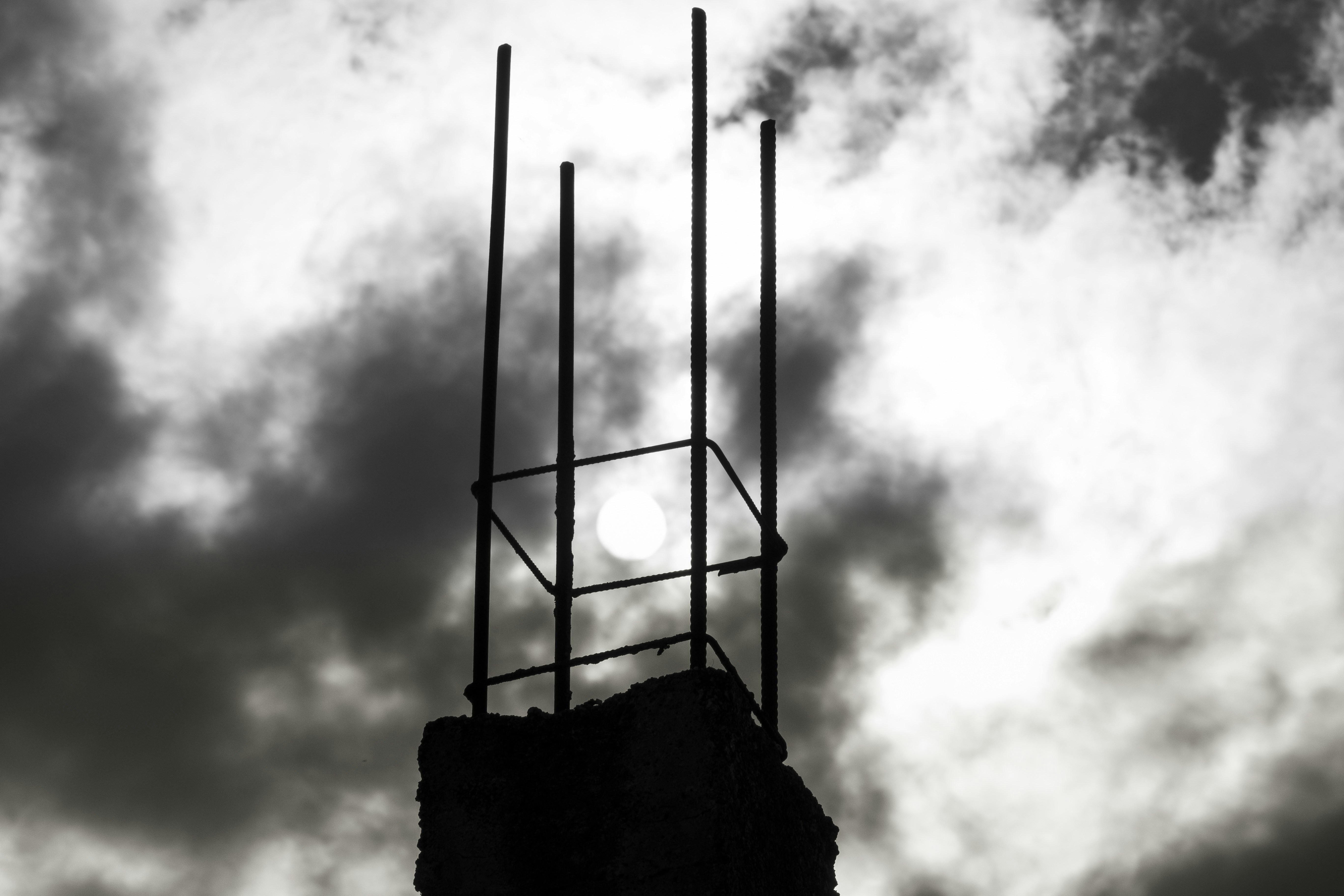 Sun behind rebar on cloudy day
