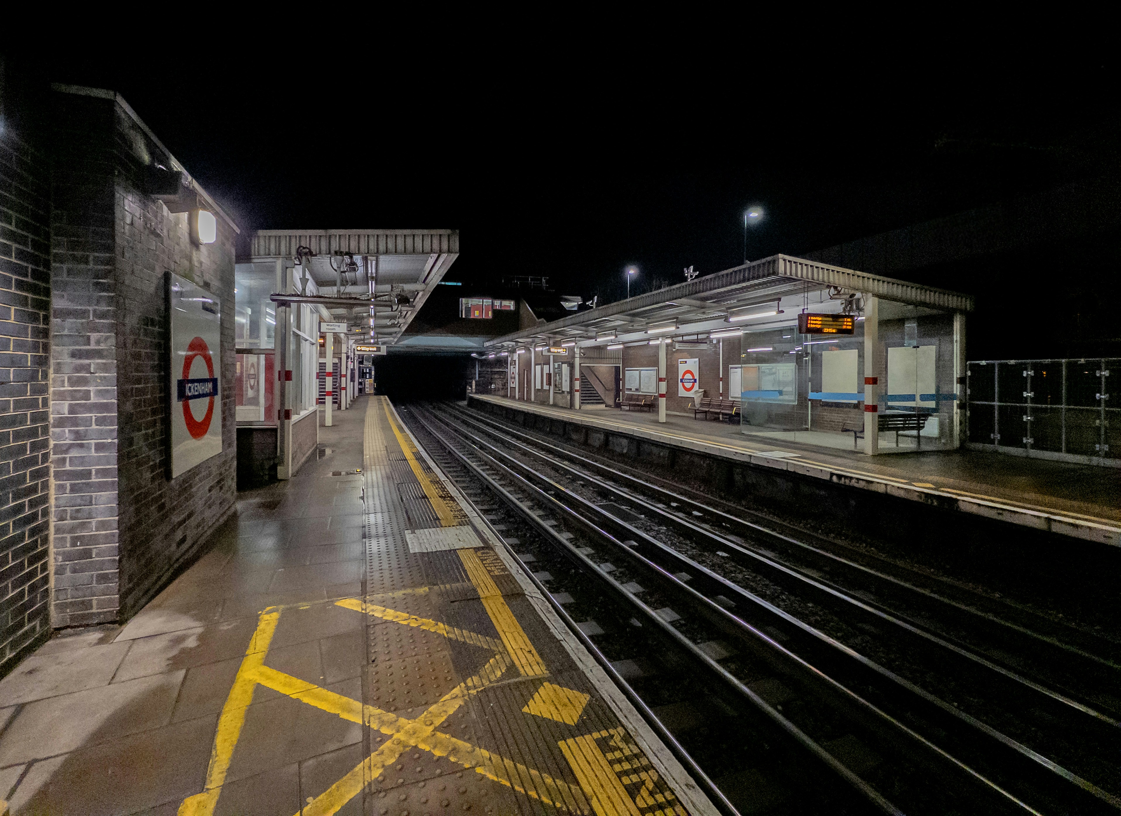Empty train station platform at night