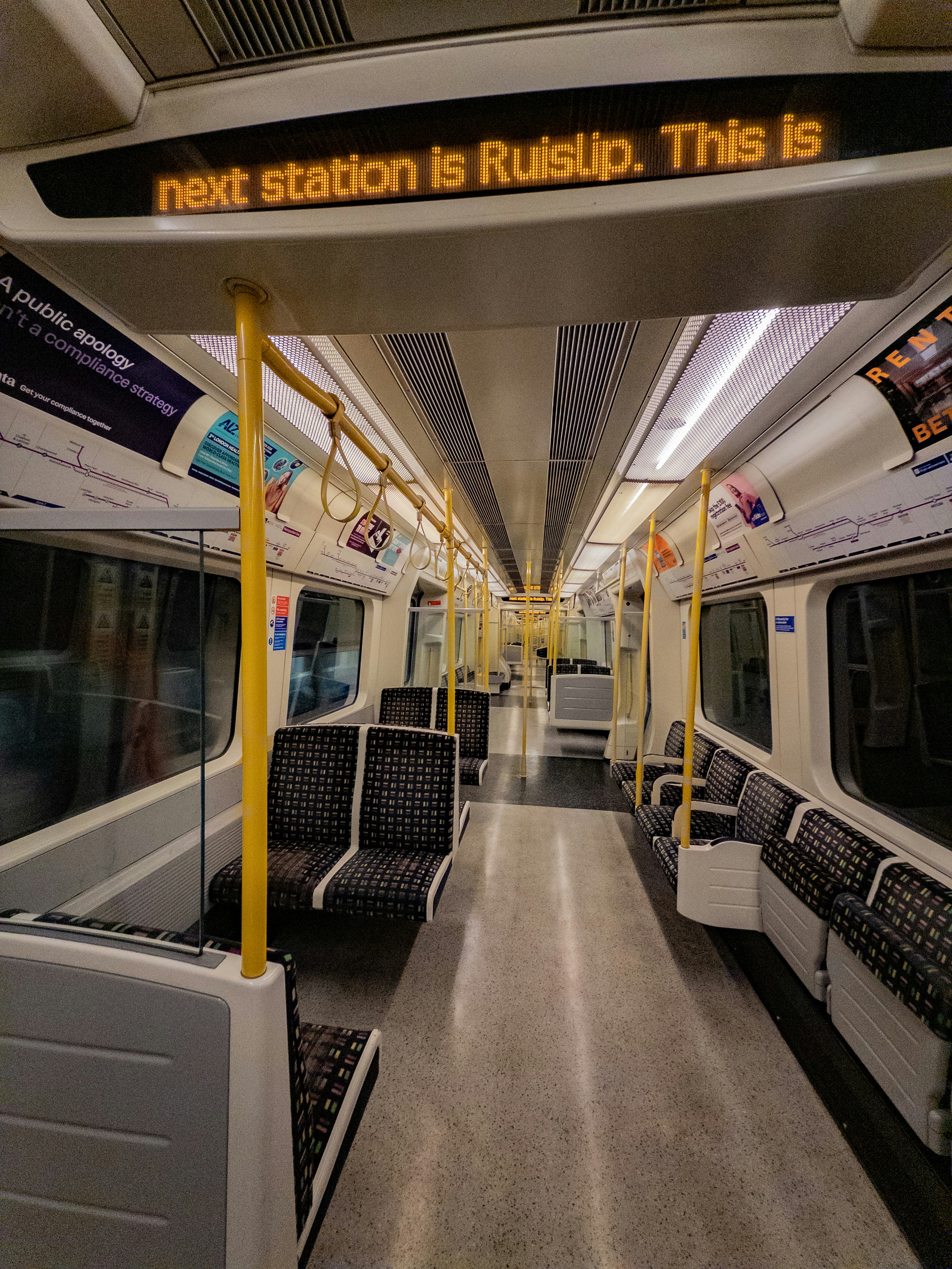Interior of an empty train with destination sign