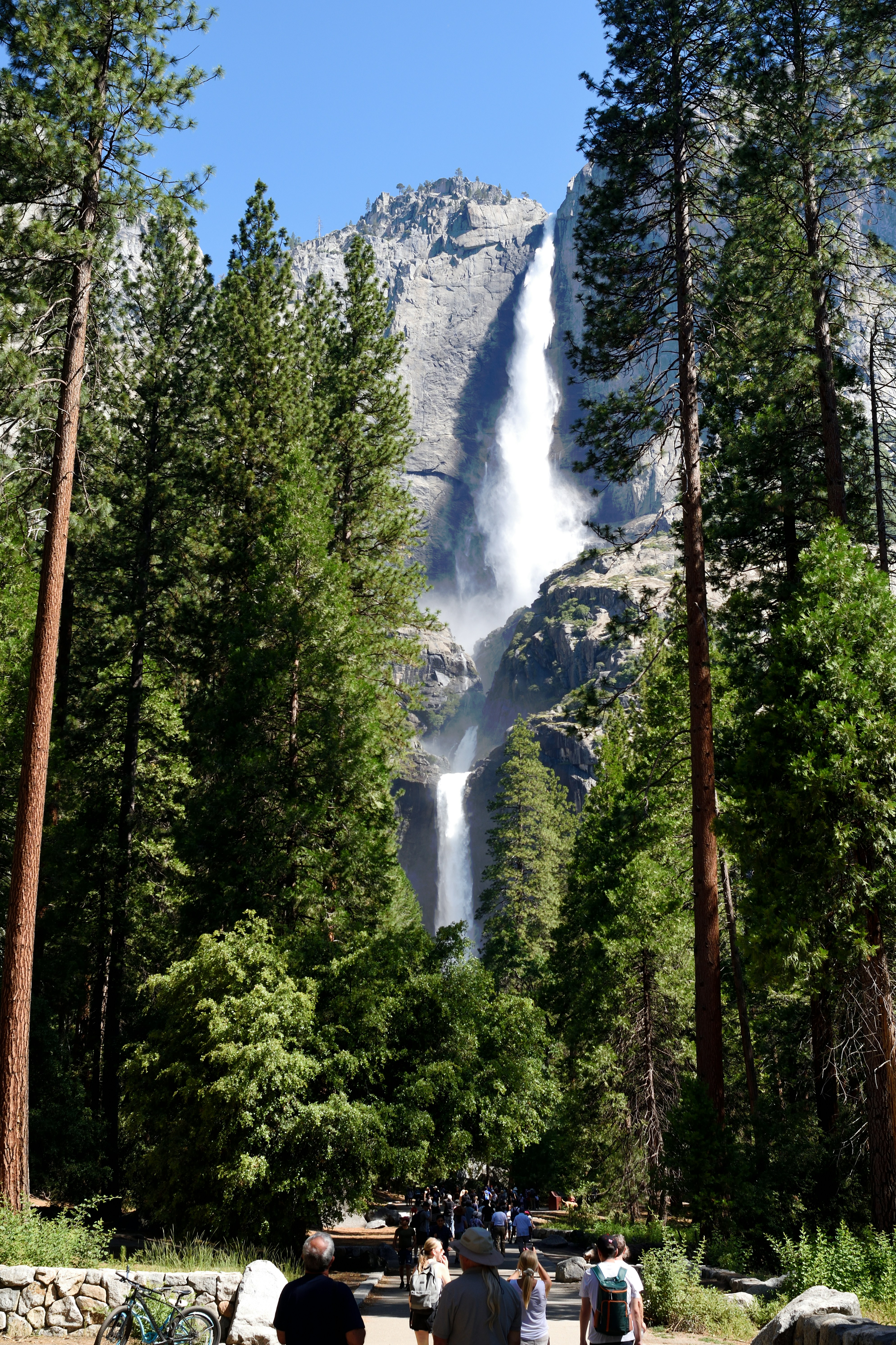 Tall waterfall cascading down a rocky cliff face.