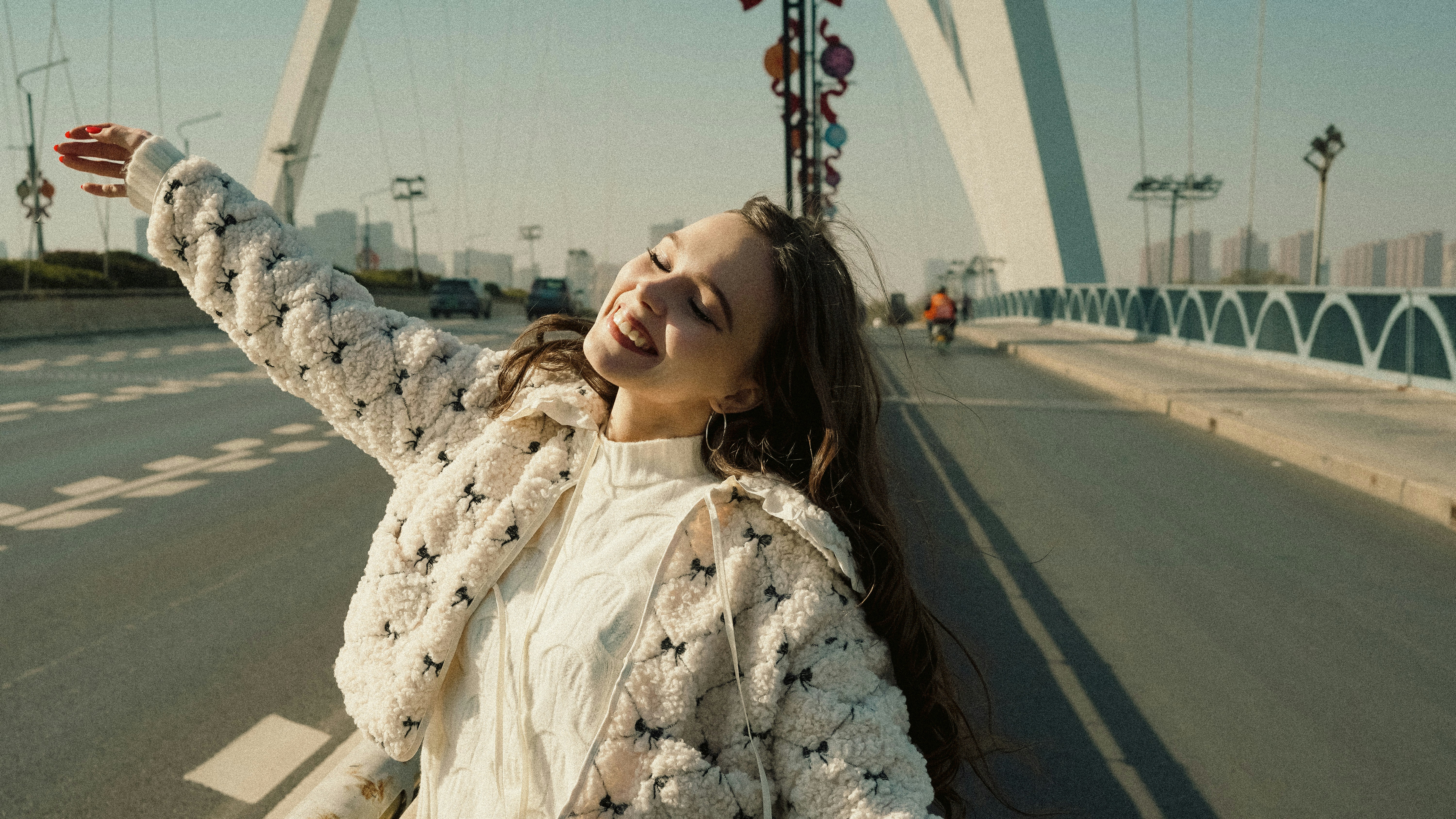 Young woman taking a selfie on a bridge
