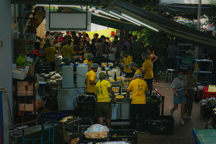 Fresh whole durian fruits displayed at a tropical fruit market stall