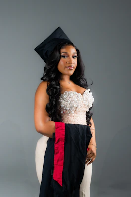 A woman in a graduation cap and gown