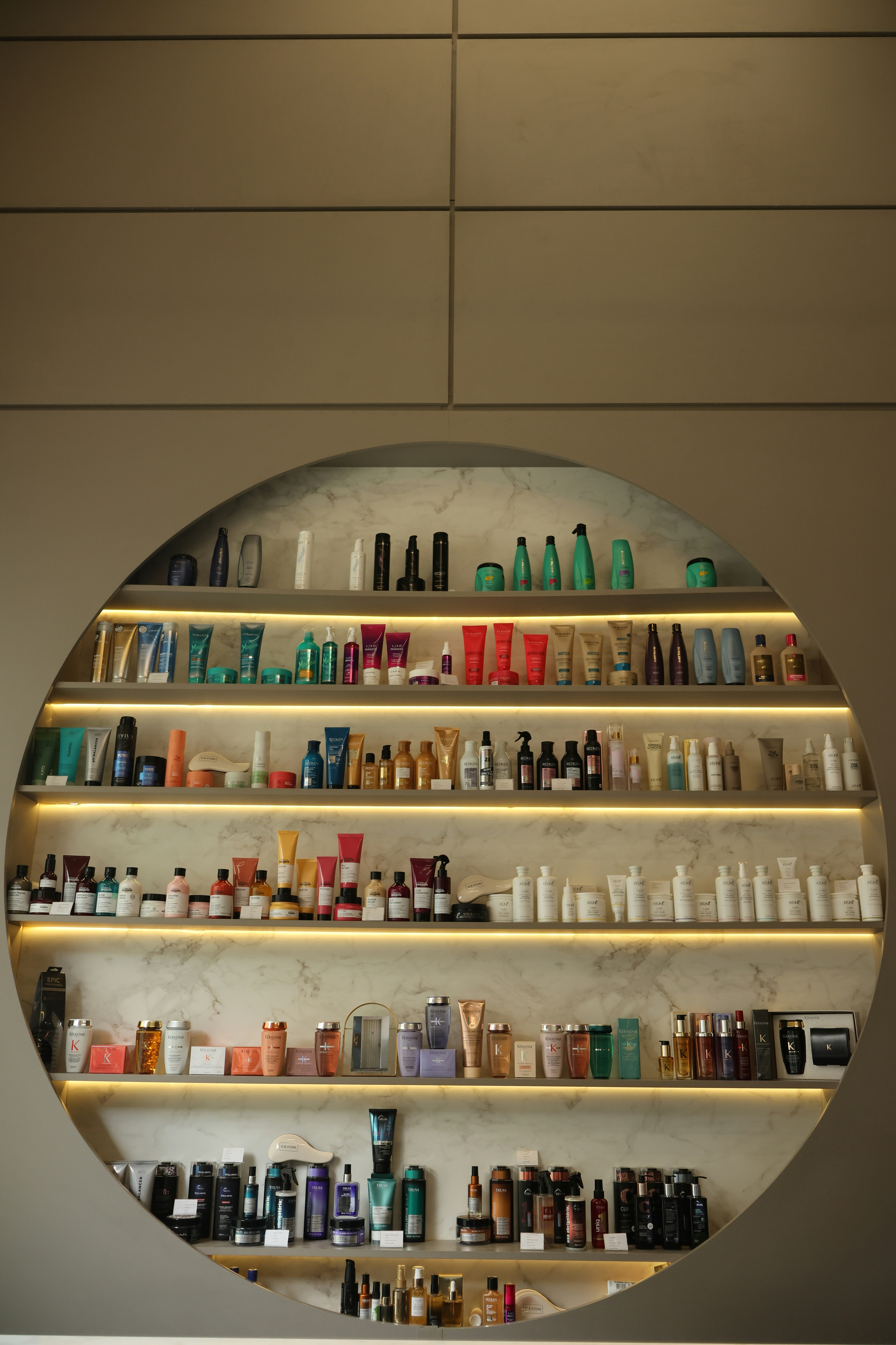 Shelves filled with various beauty products and bottles.