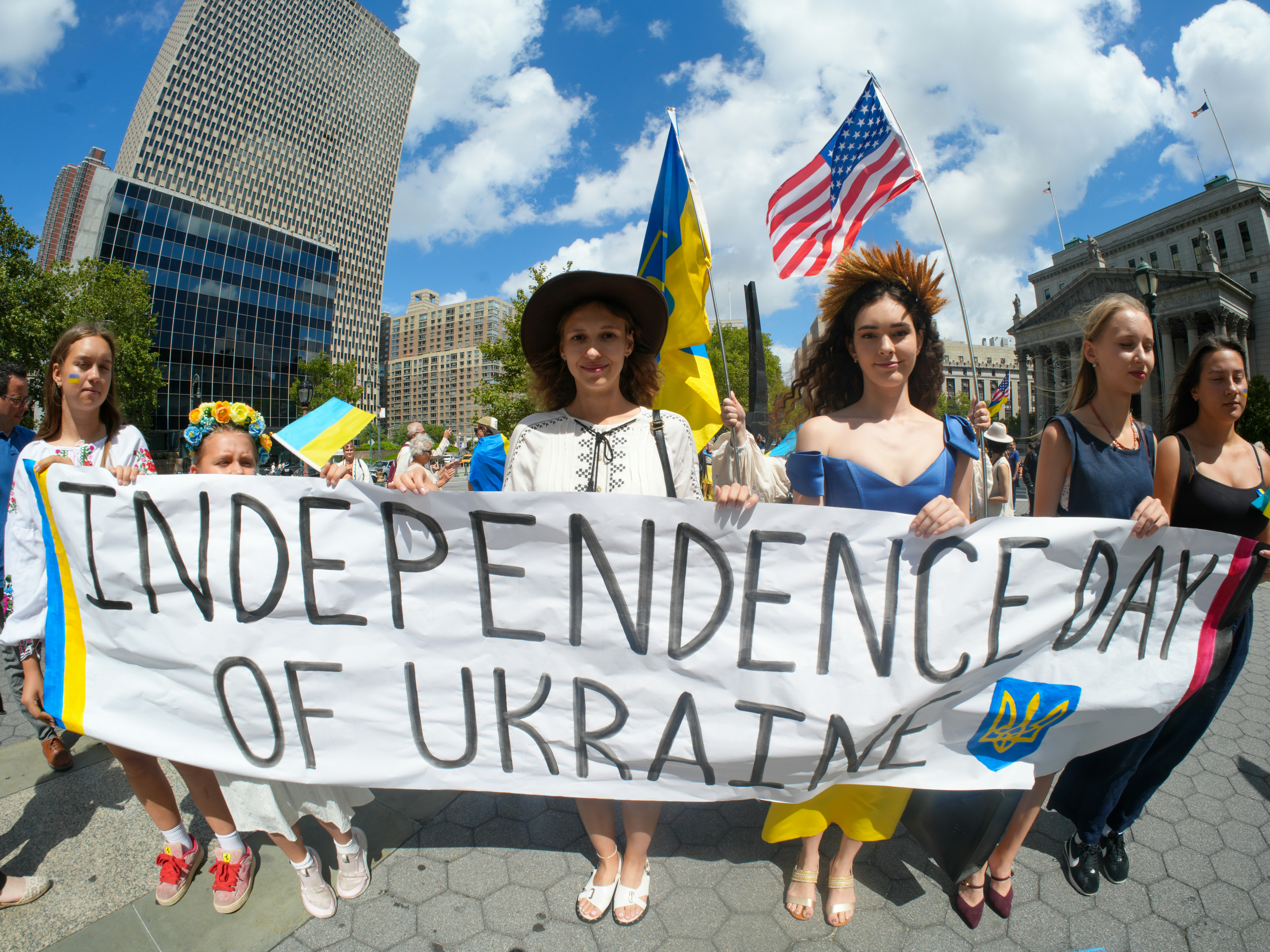 People hold banner celebrating ukraine's independence day