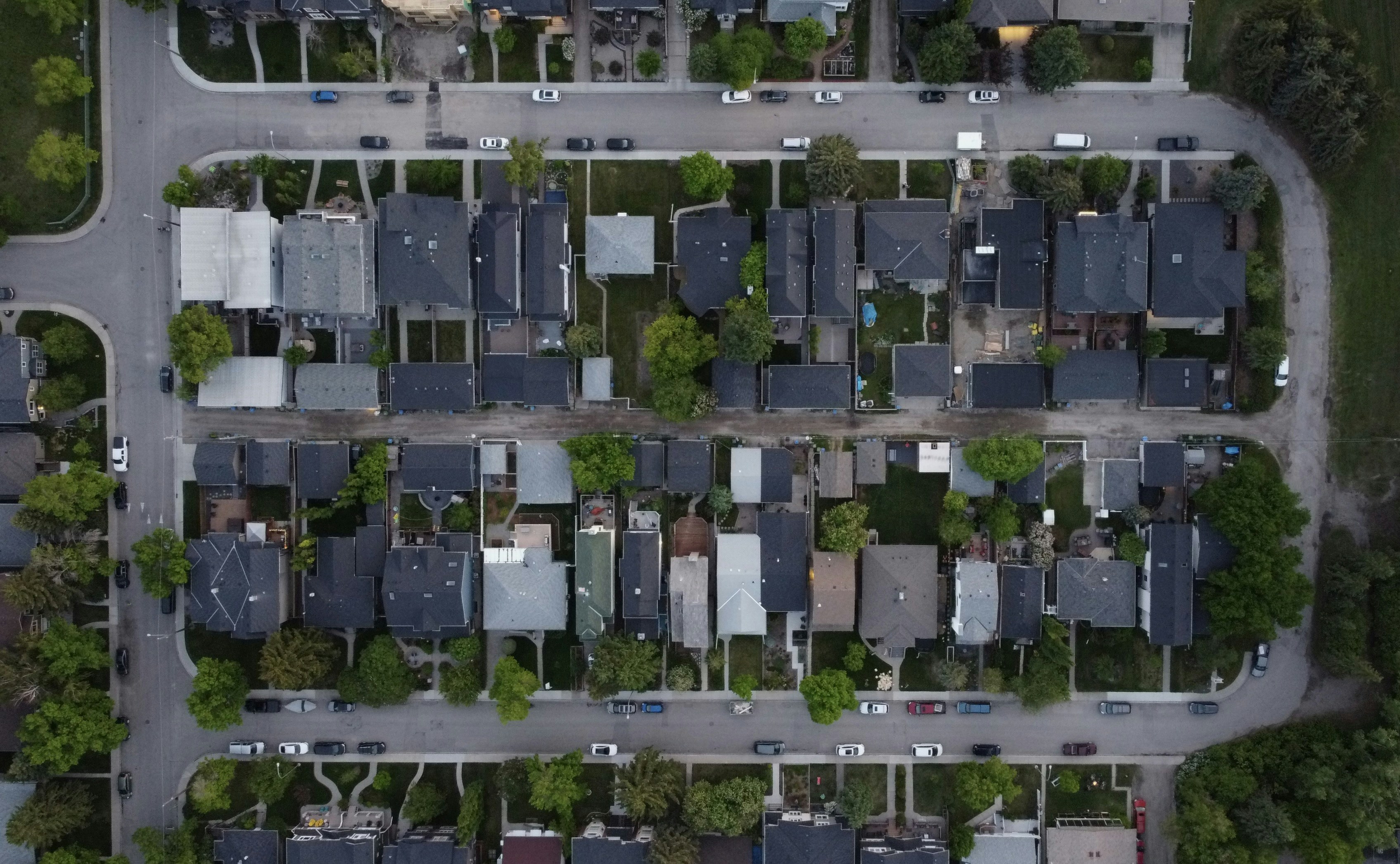Aerial view of a suburban neighborhood with houses and streets.