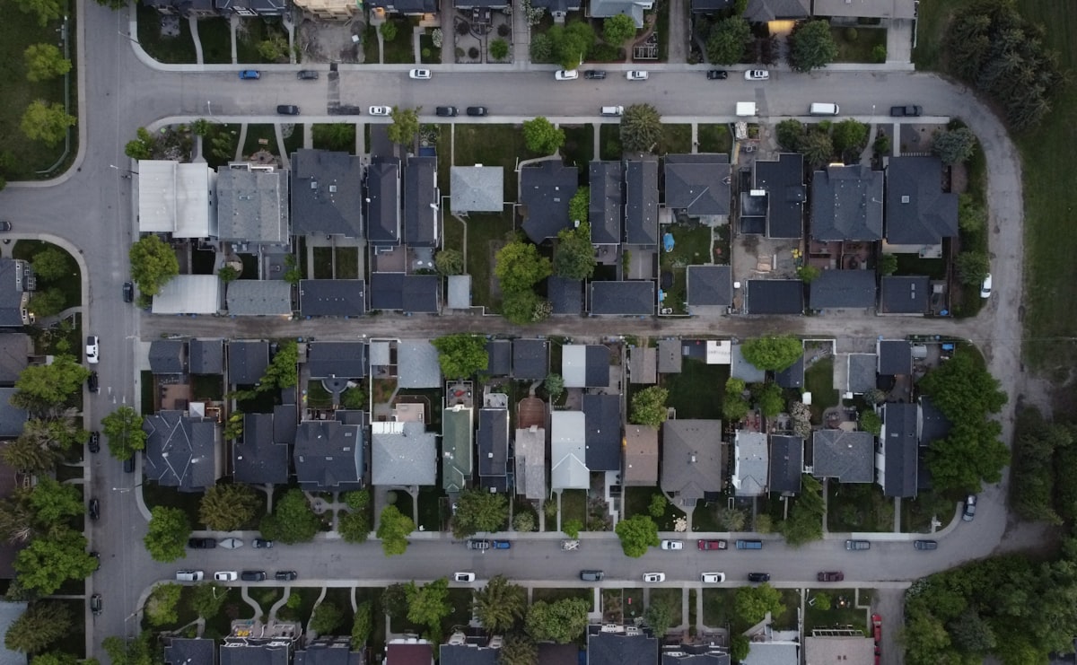 Aerial view of a suburban neighborhood with houses and streets.