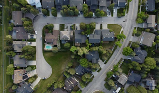 Aerial view of a suburban neighborhood with houses and streets.