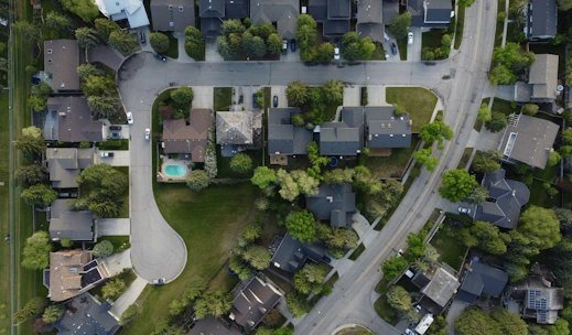 Aerial view of a suburban neighborhood with houses and streets.