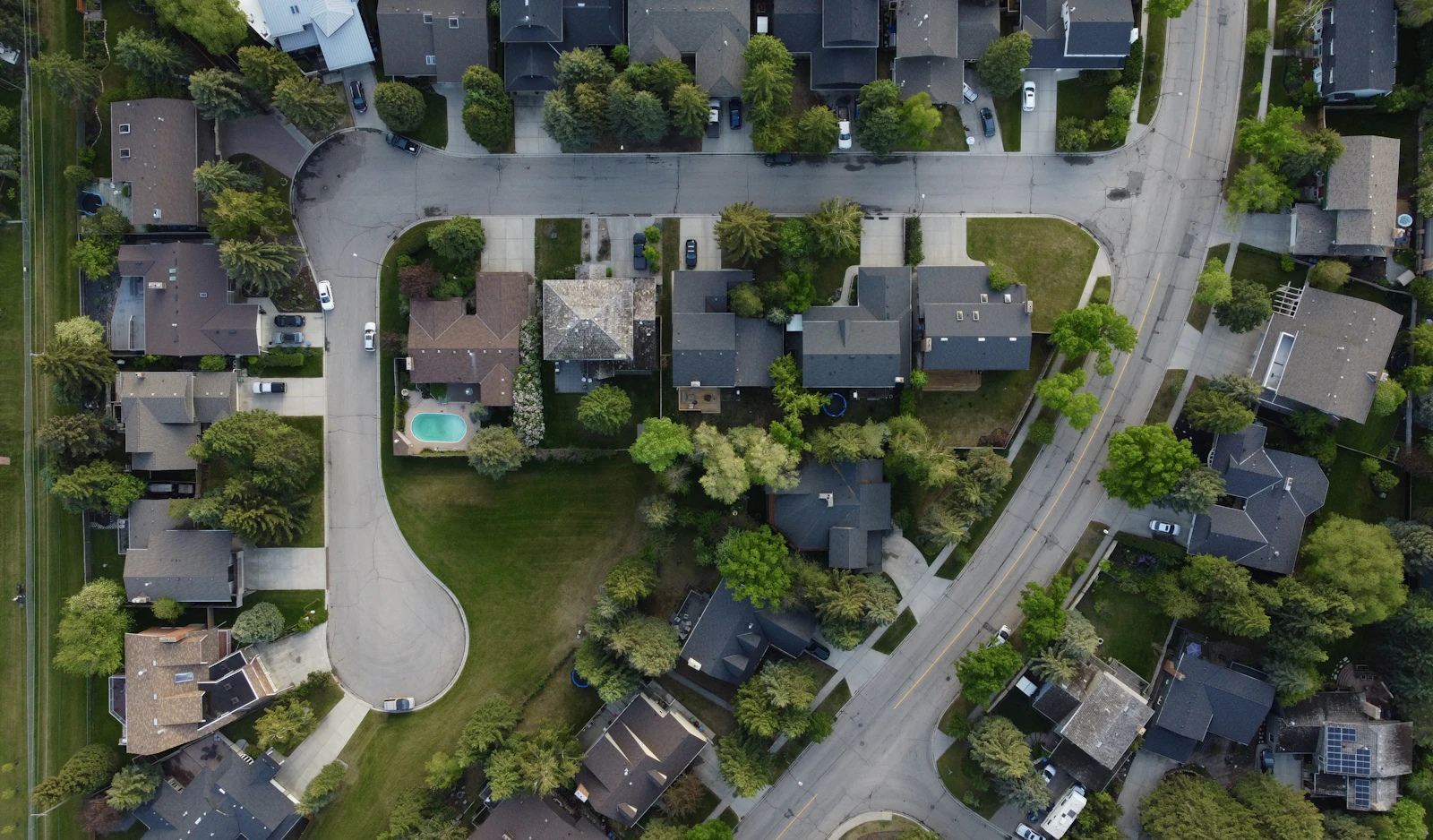 Established homes on large wooded lots with varied roof lines near White Rock Lake