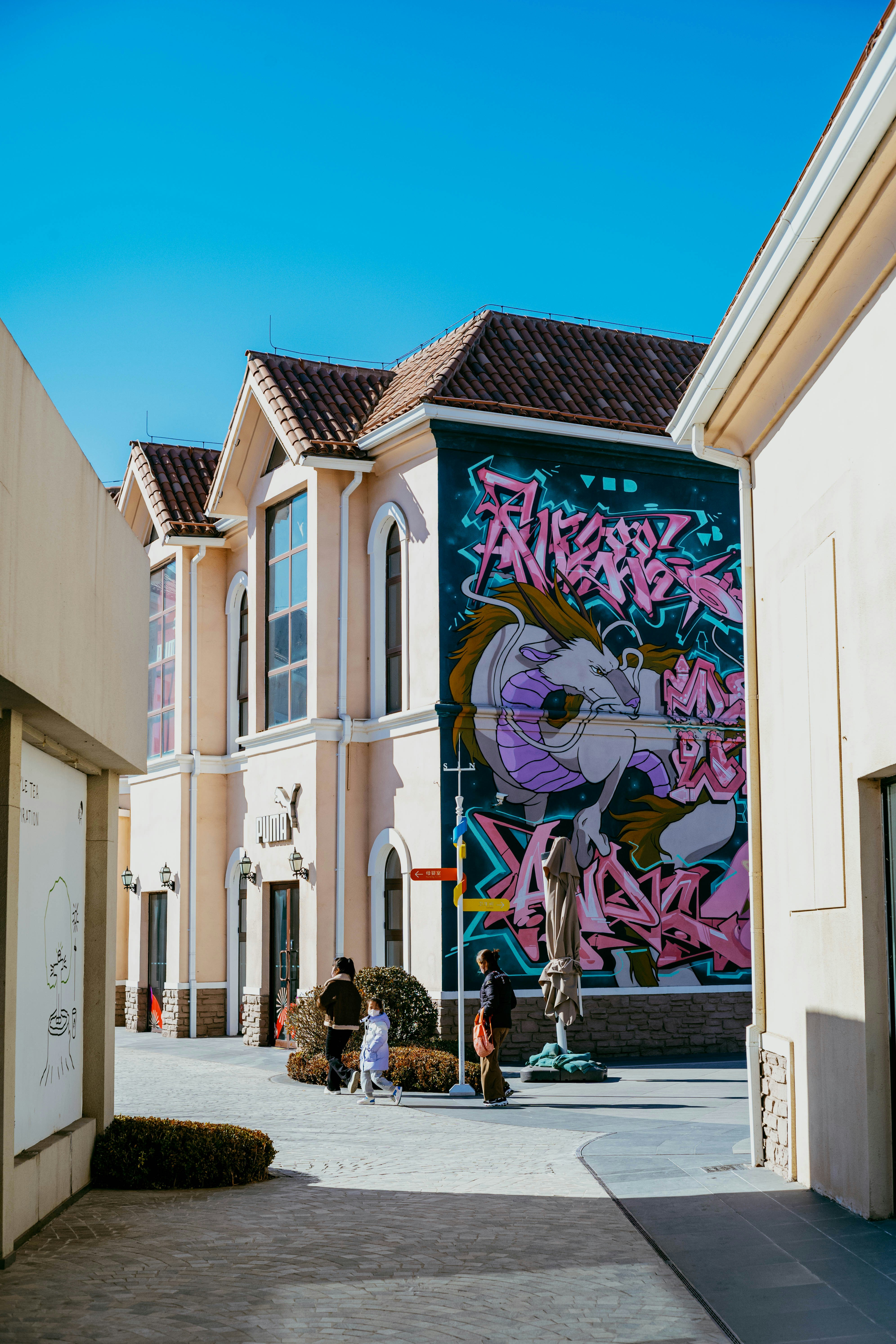 Buildings with graffiti art on a sunny day.
